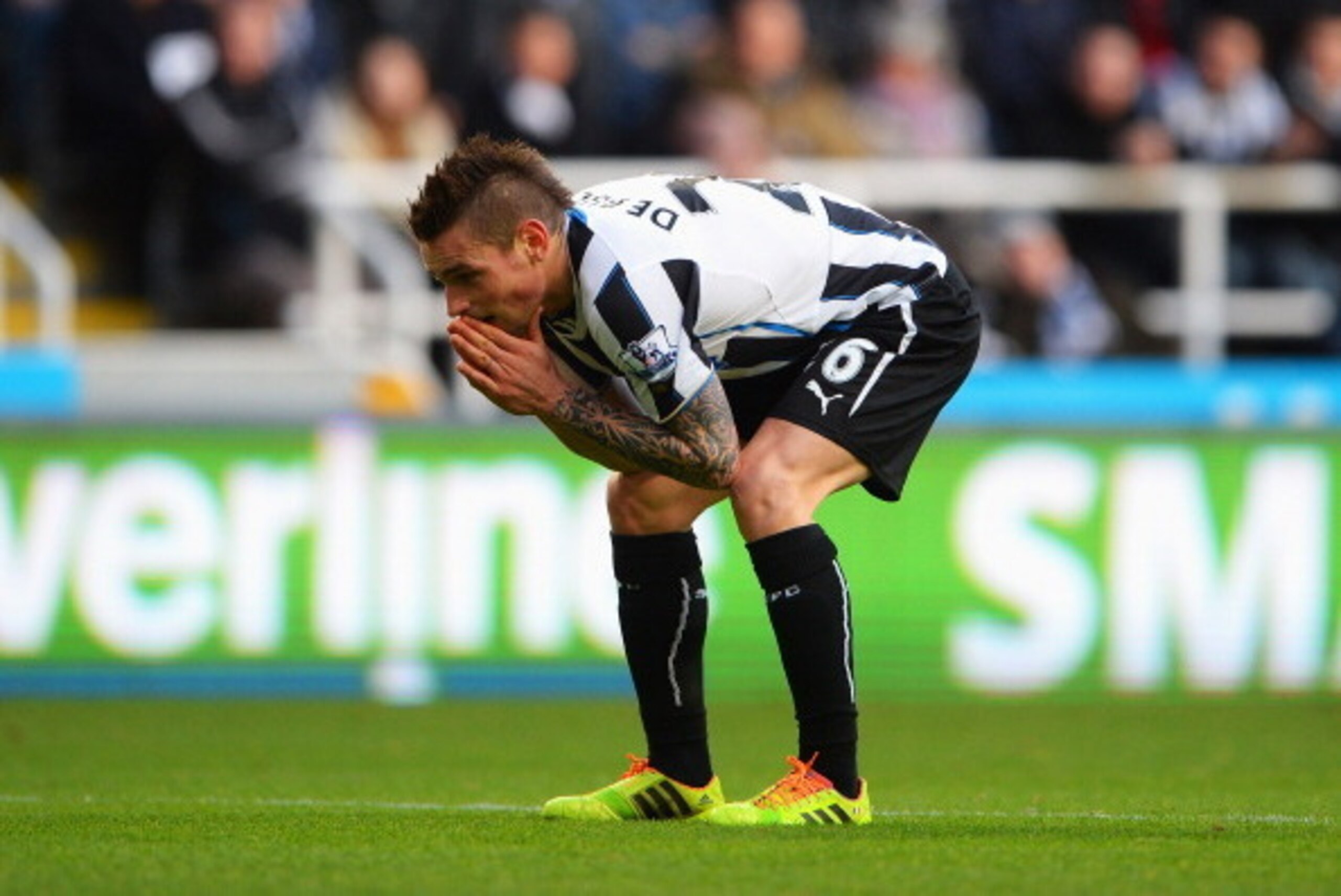 NEWCASTLE UPON TYNE, ENGLAND - DECEMBER 29: Mathieu Debuchy of Newcastle United reacts during the Barclays Premier League match between Newcastle United and Arsenal at St James' Park on December 29, 2013 in Newcastle upon Tyne, England.  (Photo by Michael