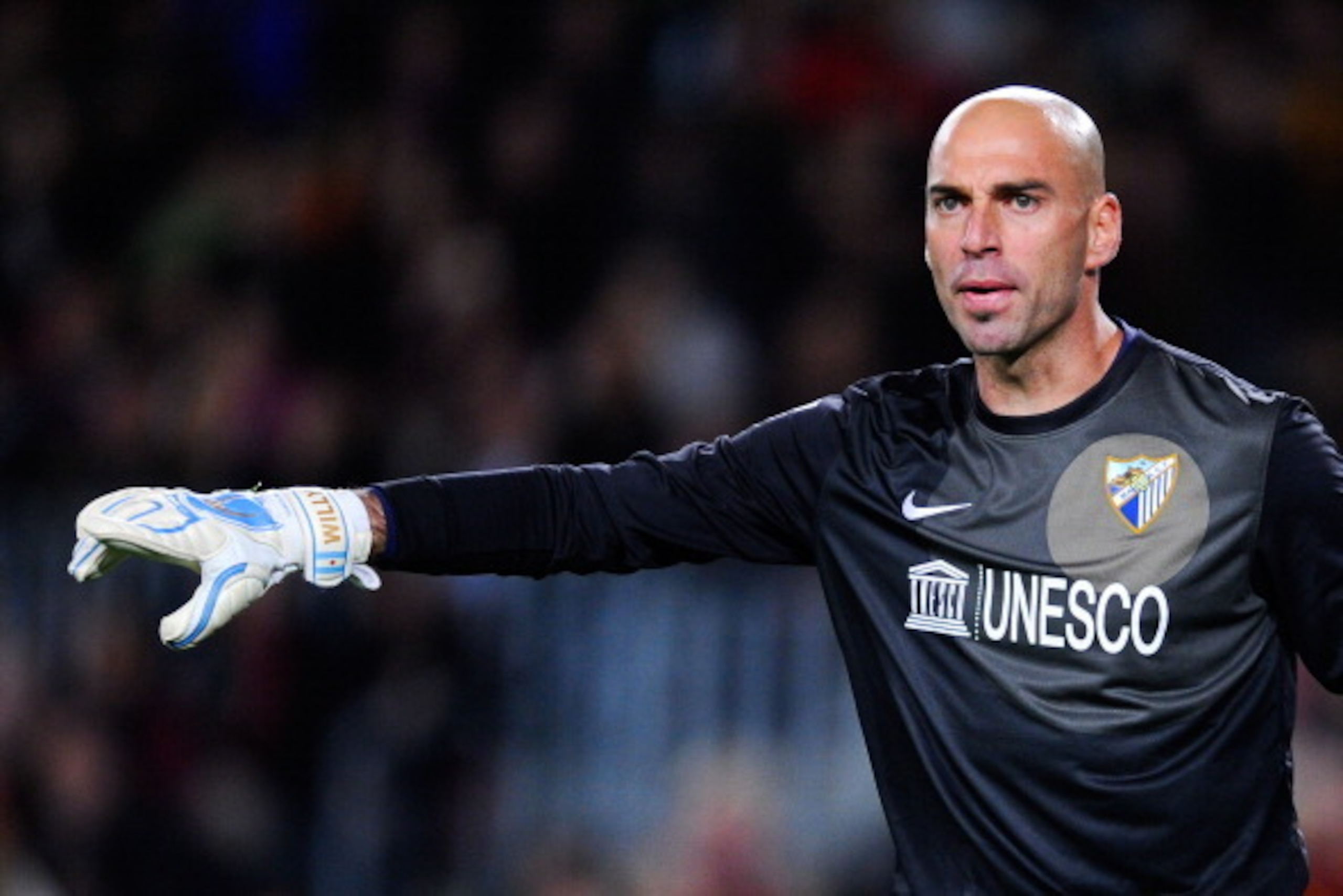 BARCELONA, SPAIN - JANUARY 26:  Willy Caballero of Malaga CF looks on during the La Liga match between FC Barcelona and Malaga CF at Camp Nou on January 26, 2014 in Barcelona, Spain.  (Photo by David Ramos/Getty Images)
