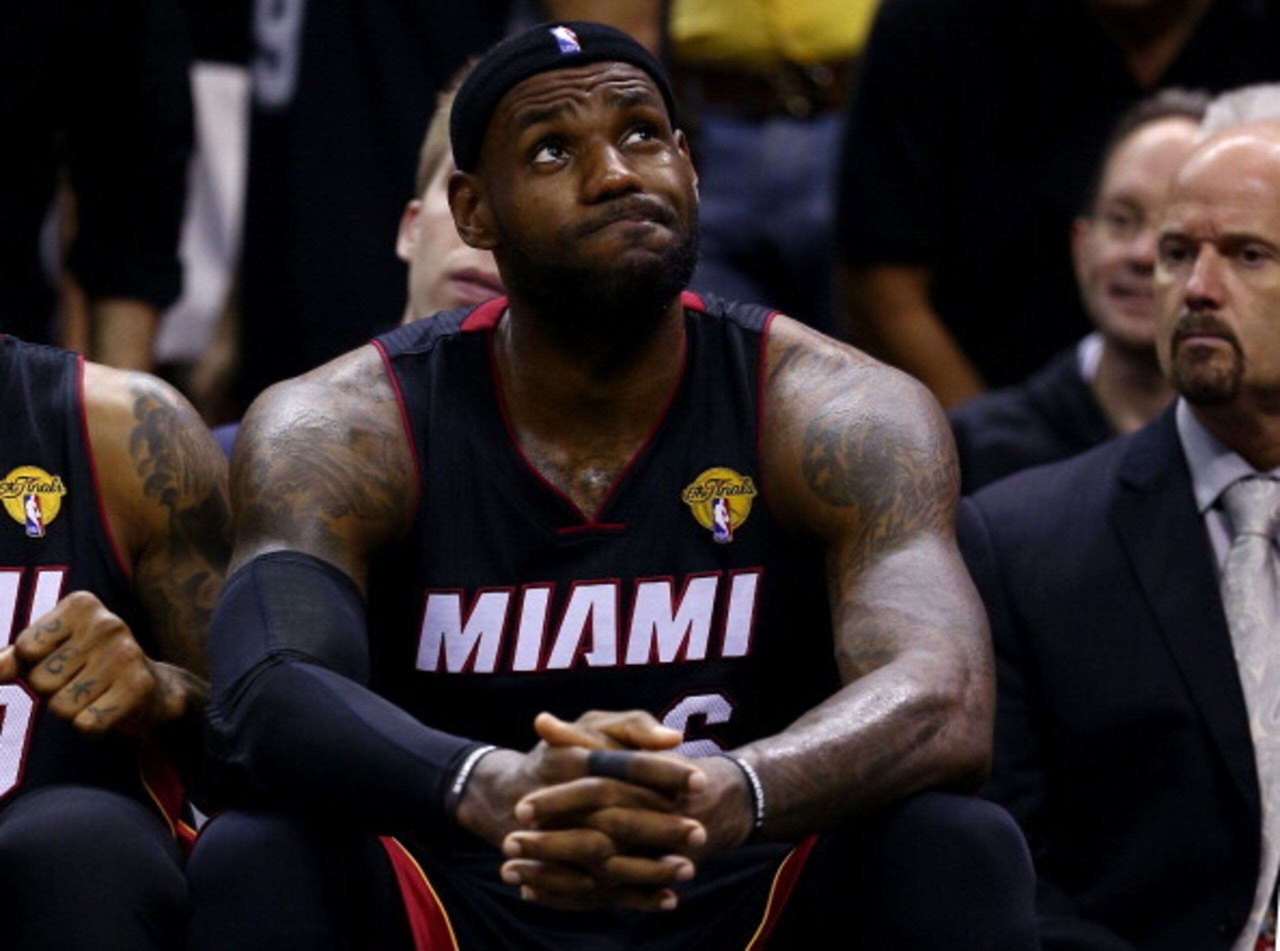 SAN ANTONIO, TX - JUNE 15:  LeBron James #6 of the Miami Heat reacts on the bench against the San Antonio Spurs during Game Five of the 2014 NBA Finals at the AT&T Center on June 15, 2014 in San Antonio, Texas. NOTE TO USER: User expressly acknowledges an