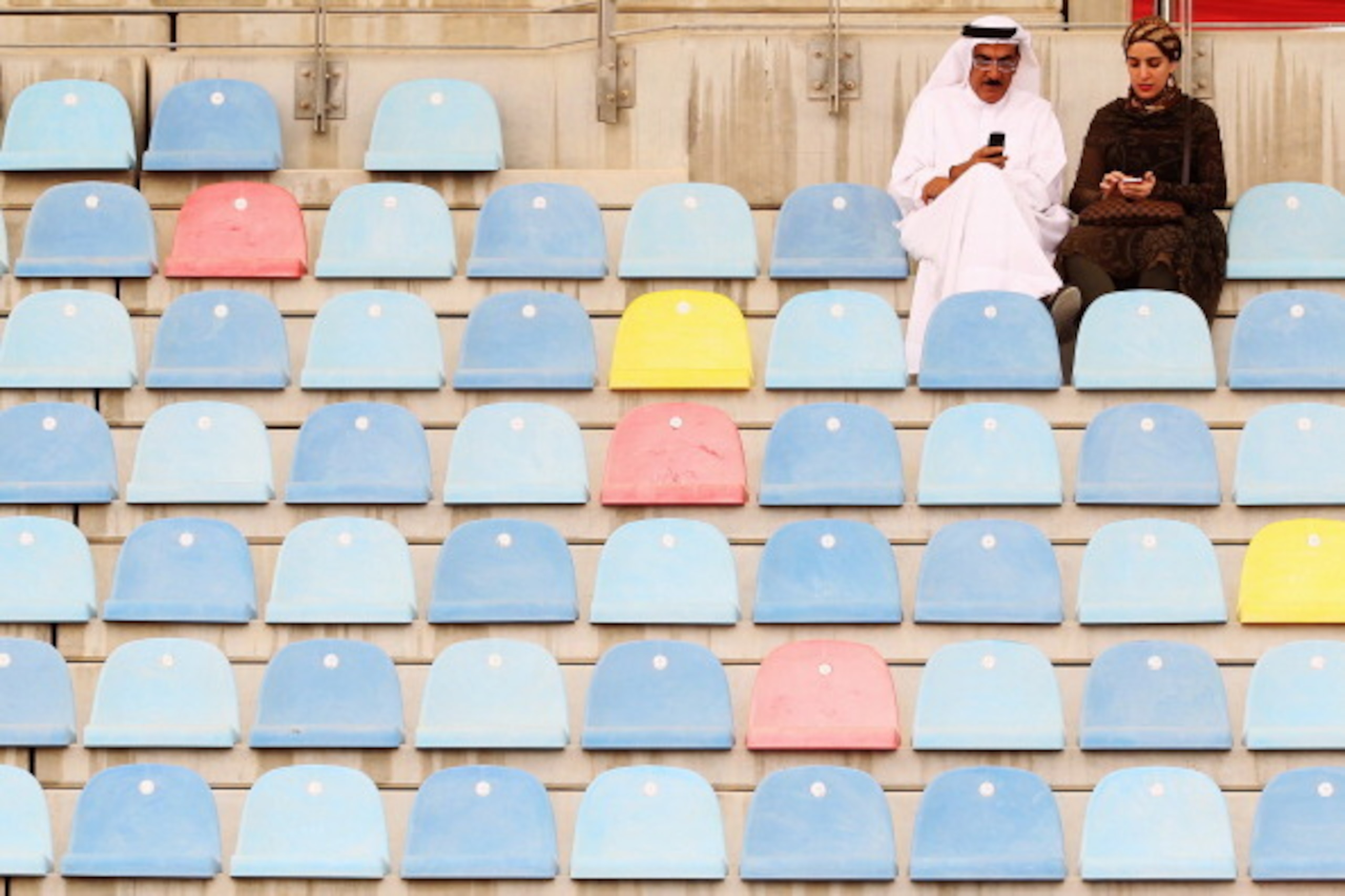 SAKHIR, BAHRAIN - APRIL 22:  Fans sit in the grandstand before the Bahrain Formula One Grand Prix at the Bahrain International Circuit on April 22, 2012 in Sakhir, Bahrain.  (Photo by Mark Thompson/Getty Images)