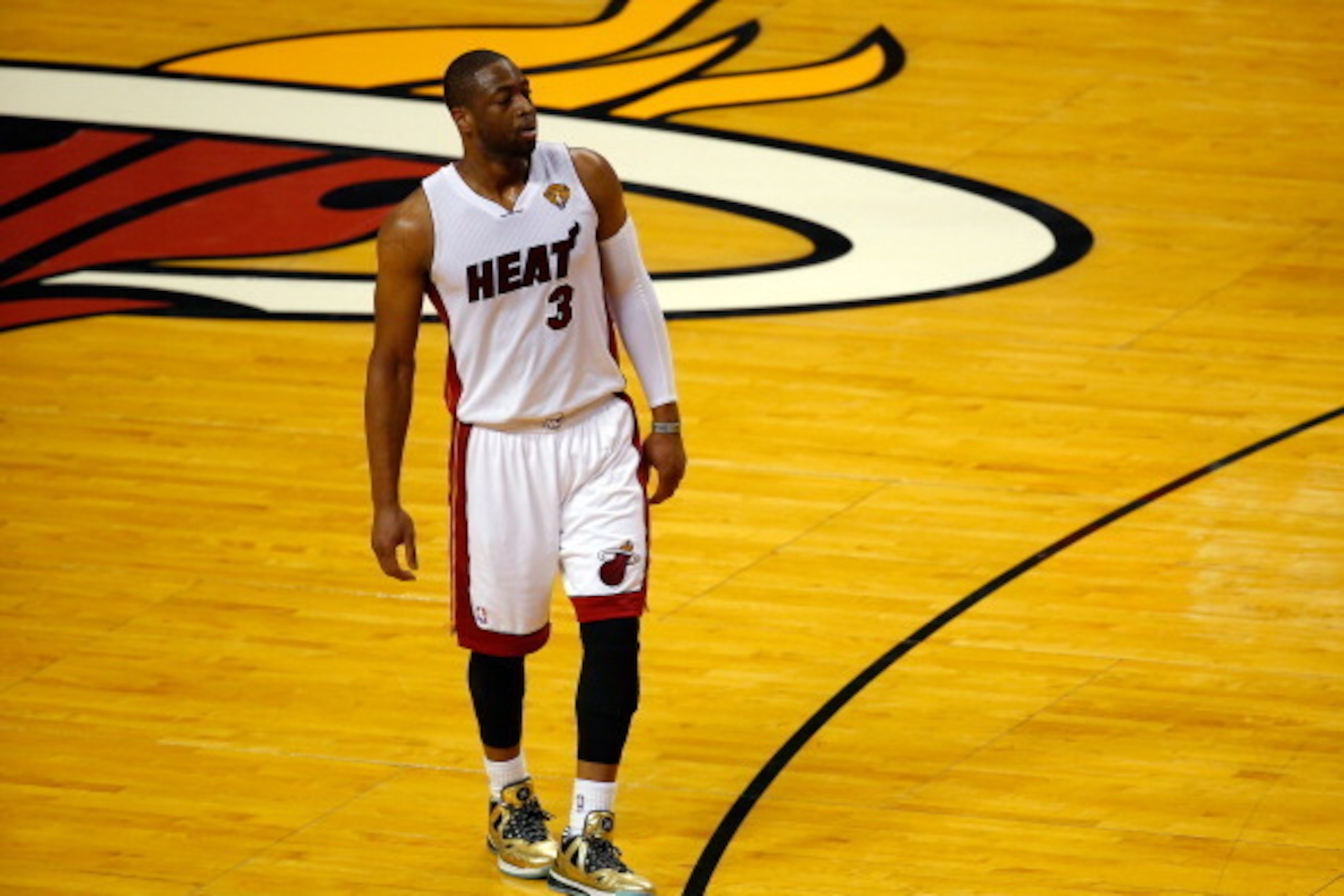 MIAMI, FL - JUNE 12: Dwyane Wade #3 of the Miami Heat looks on against the San Antonio Spurs during Game Four of the 2014 NBA Finals at American Airlines Arena on June 12, 2014 in Miami, Florida. NOTE TO USER: User expressly acknowledges and agrees that, 