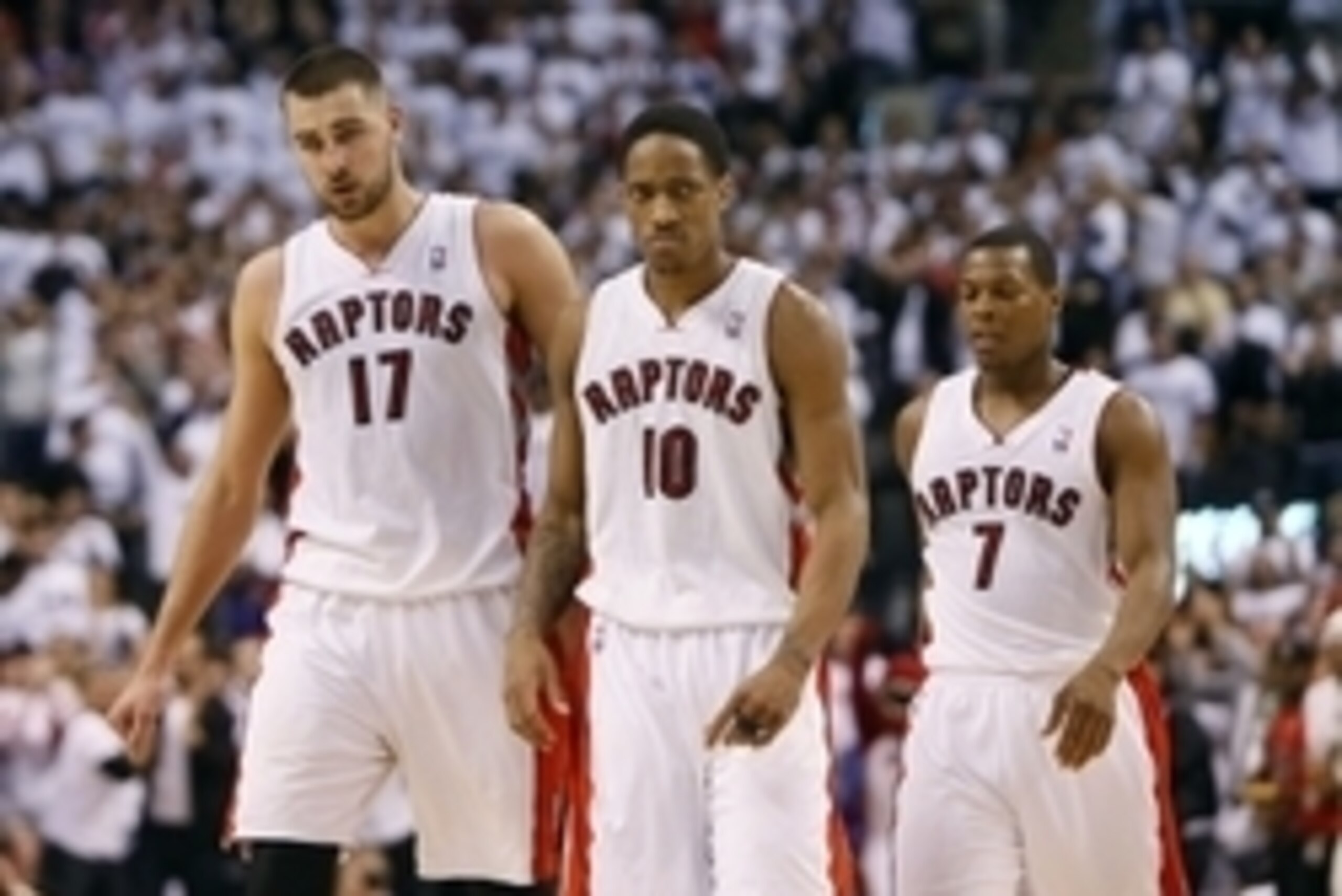 Apr 22, 2014; Toronto, Ontario, CAN; Toronto Raptors guard DeMar DeRozan (10) and center Jonas Valanciunas (17) and guard Kyle Lowry (7) come off the court after a play against the Brooklyn Nets in game two during the first round of the 2014 NBA Playoffs 