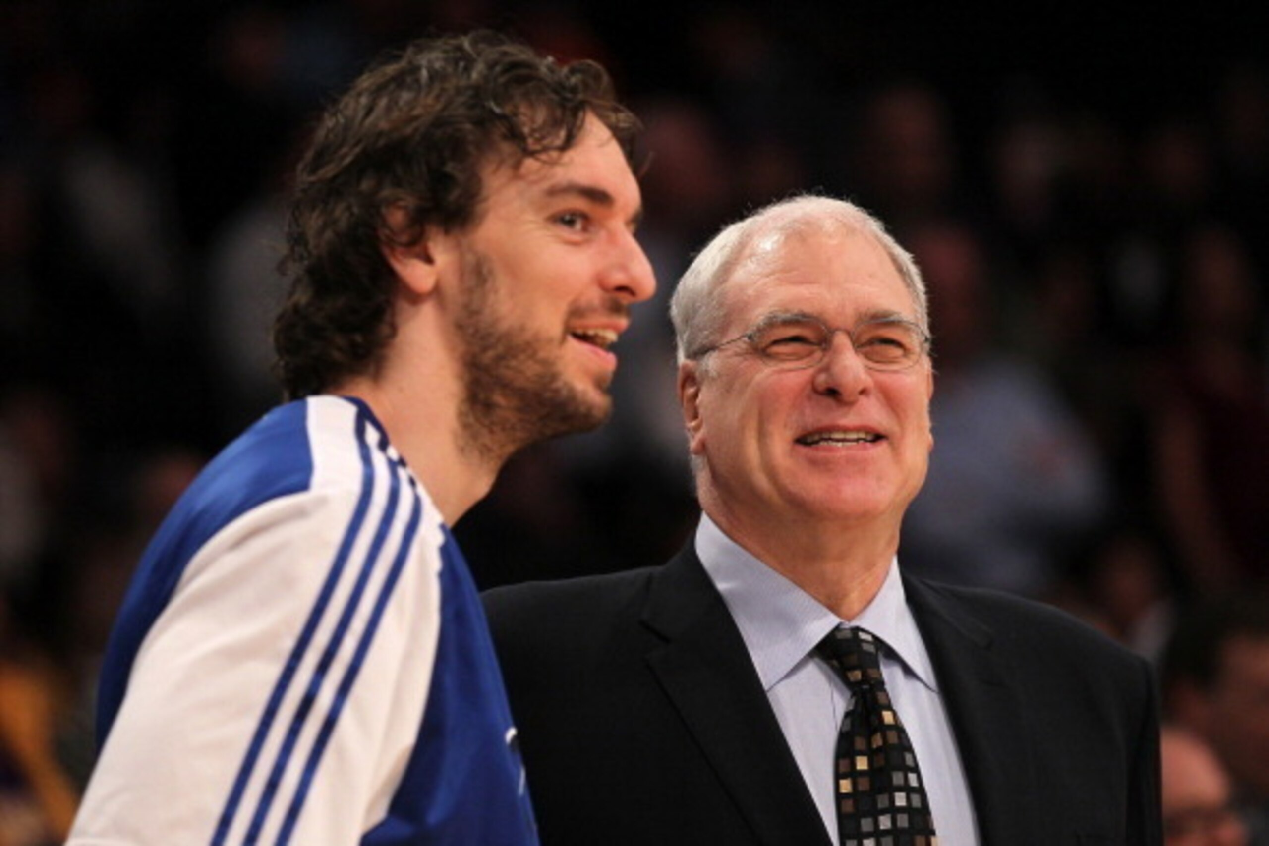 LOS ANGELES, CA - JANUARY 11:   Head coach Phil Jackson and Pau Gasol #16 of the Los Angeles Lakers laugh before the game with the Cleveland Cavaliers at Staples Center on January 11, 2011 in Los Angeles, California.  The Lakers won 112-57.  NOTE TO USER: