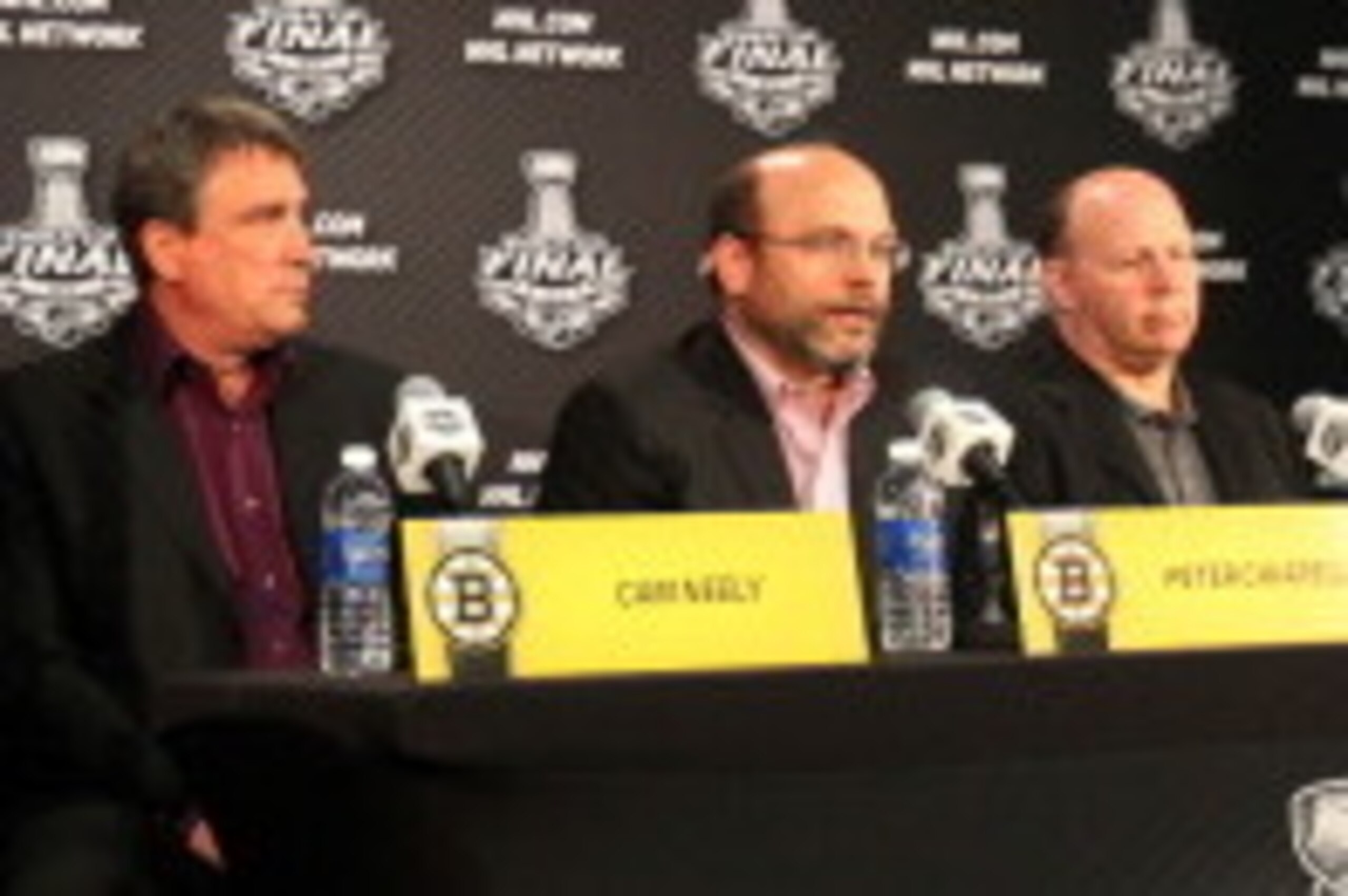 CHICAGO, IL- JUNE 11:  Cam Neely, President of the Boston Bruins, speaks with the media along with Peter Chiarelli, General Manager, and Head Coach Claude Julien during the 2013 Stanley Cup Final Media Day at the United Center on June 11, 2013 in Chicago,