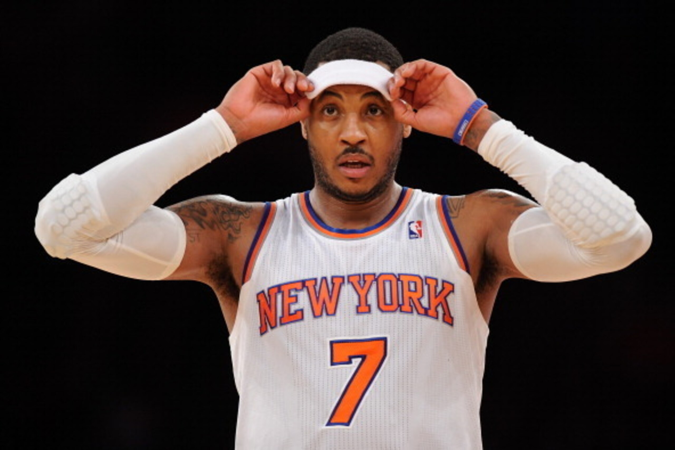 NEW YORK, NY - DECEMBER 16:  Carmelo Anthony #7 of the New York Knicks looks on during the second half against the Washington Wizards at Madison Square Garden on December 16, 2013 in New York City. NOTE TO USER: User expressly acknowledges and agrees that