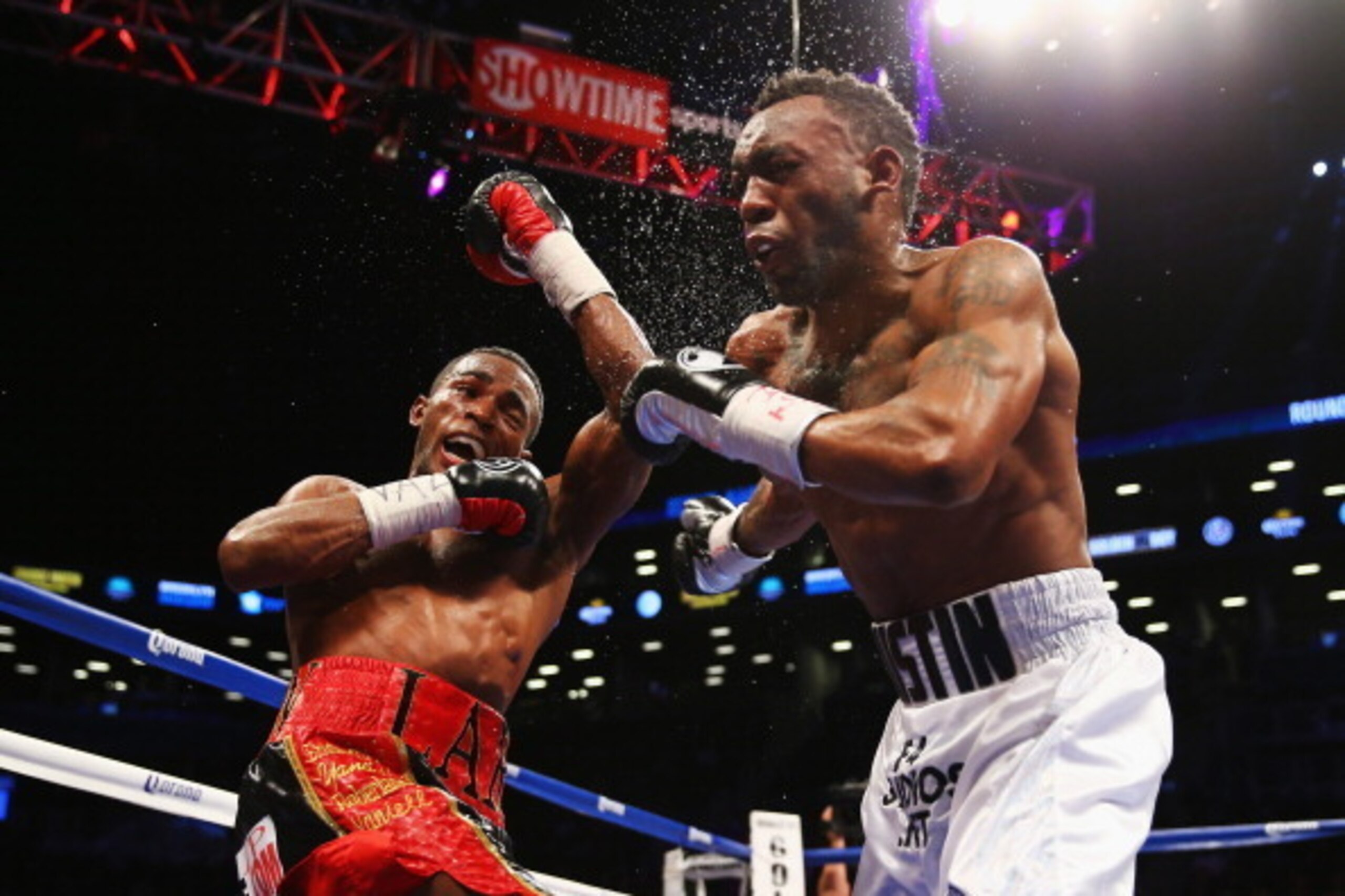 NEW YORK, NY - DECEMBER 07:  Erislandy Lara punches Austin Trout during their WBA interim junior middleweight title fight at the Barclays Center on December 7, 2013 in the Brooklyn Borough of New York City.  (Photo by Al Bello/Getty Images)