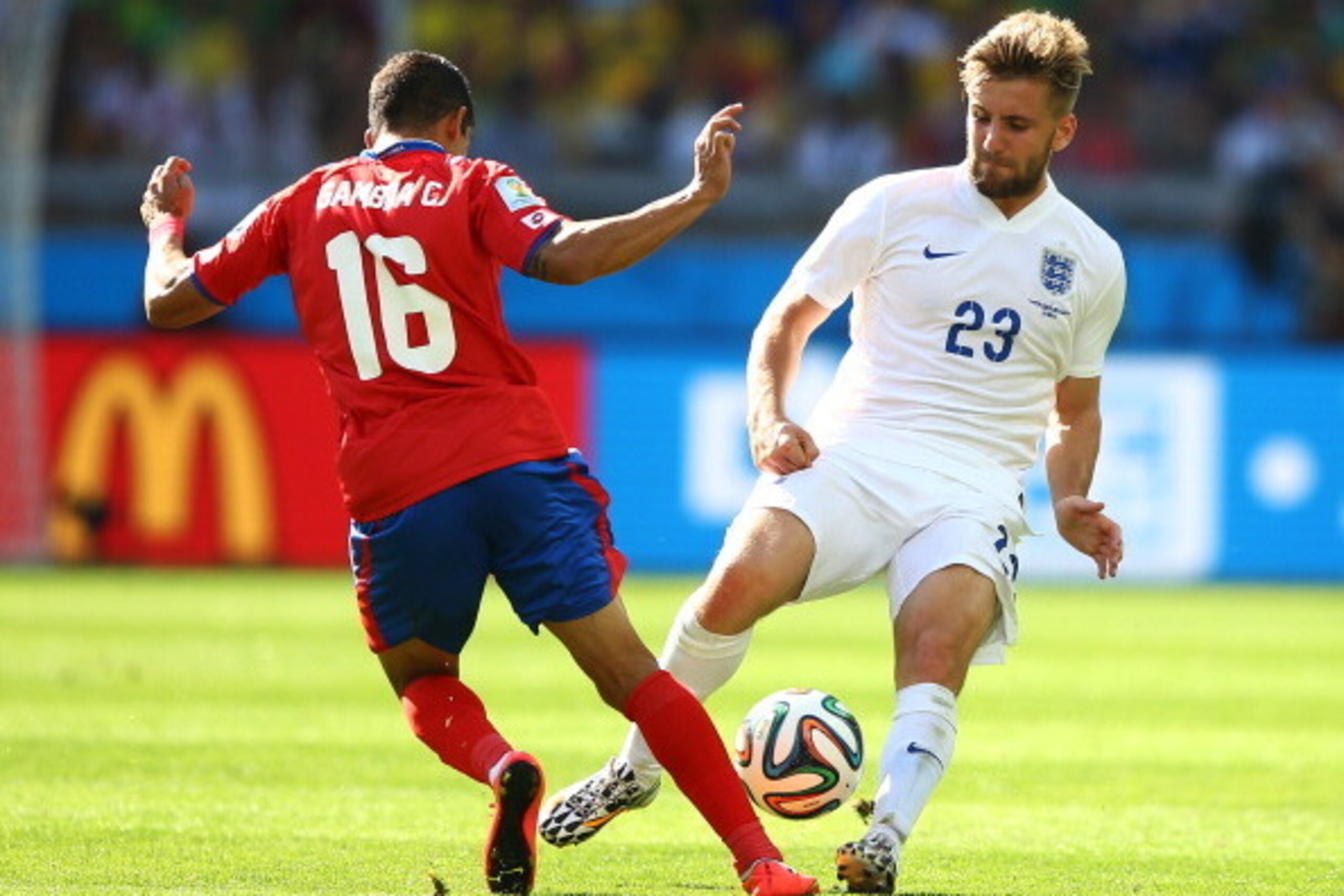 BELO HORIZONTE, BRAZIL - JUNE 24: Cristian Gamboa of Costa Rica challenges Luke Shaw of England during the 2014 FIFA World Cup Brazil Group D match between Costa Rica and England at Estadio Mineirao on June 24, 2014 in Belo Horizonte, Brazil.  (Photo by R