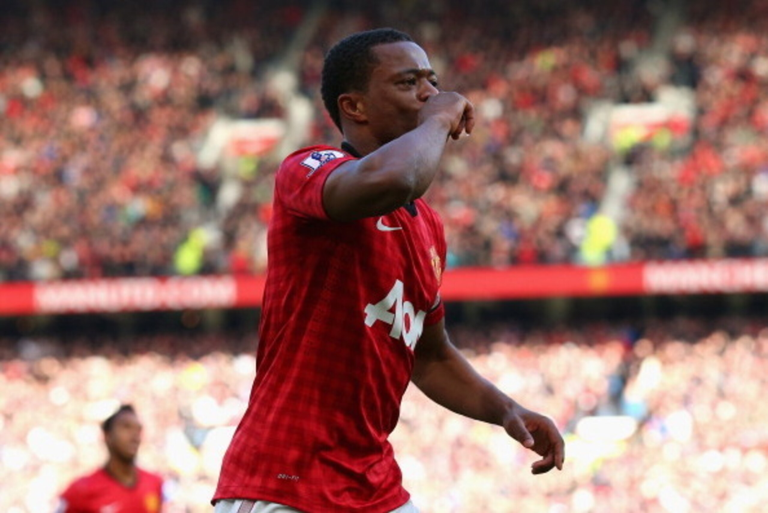 MANCHESTER, ENGLAND - NOVEMBER 03:  Patrice Evra of Manchester United celebrates scoring his team's second goal during the Barclays Premier League match between Manchester United and Arsenal at Old Trafford on November 3, 2012 in Manchester, England.  (Ph