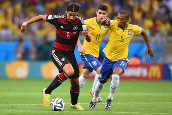 BELO HORIZONTE, BRAZIL - JULY 08:  Sami Khedira of Germany controls the ball as Oscar (center) and Fernandinho of Brazil give chase during the 2014 FIFA World Cup Brazil Semi Final match between Brazil and Germany at Estadio Mineirao on July 8, 2014 in Be