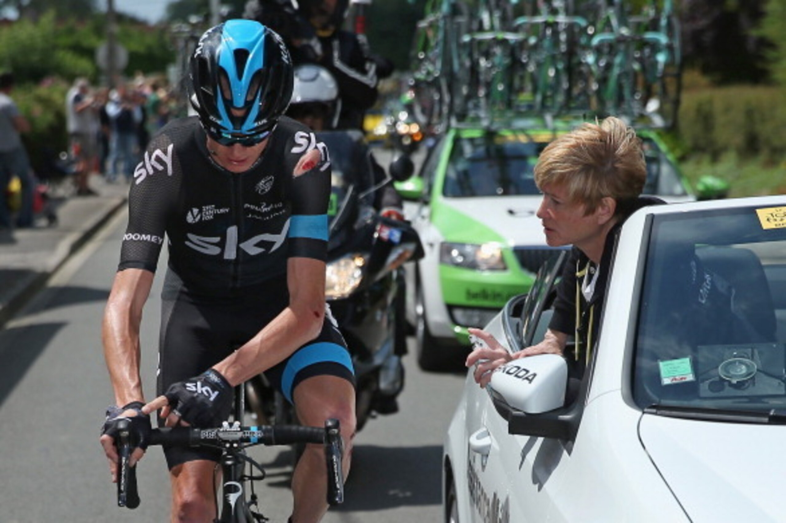 LE TOUQUET-PARIS-PLAGE, FRANCE - JULY 08:  Chris Froome of Great Britain and Team Sky receives medical attention after being involved in a crash early in the race during stage four of the 2014 Le Tour de France from Le Touquet-Paris-Plage to Lille on July