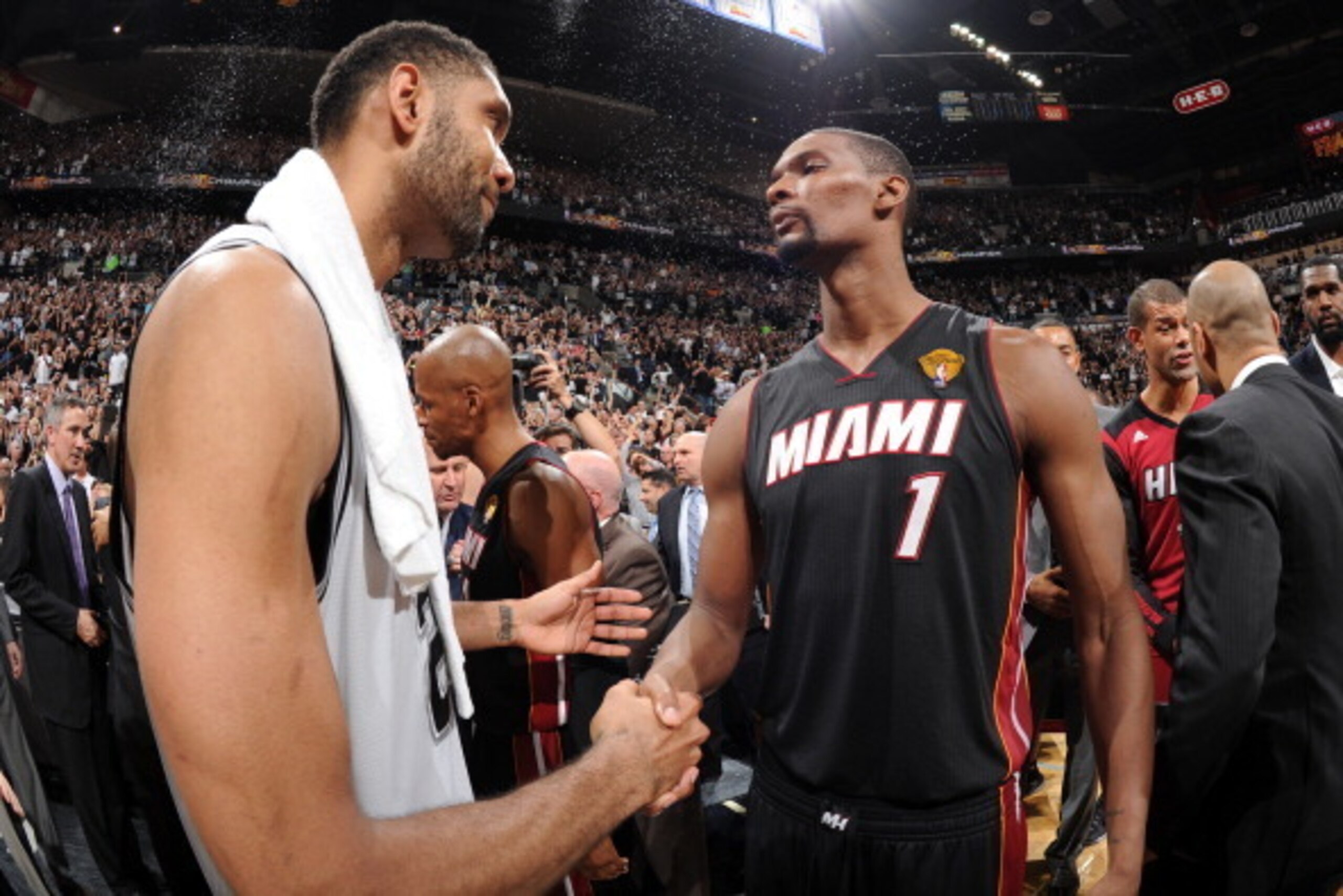 SAN ANTONIO, TX - JUNE 15: Tim Duncan #21 of the San Antonio Spurs and Chris Bosh #1 of the Miami Heat shake hands after the San Antonio Spurs' victory in Game Five and winning the 2014 NBA Finals between the Miami Heat and San Antonio Spurs at AT&T Cente