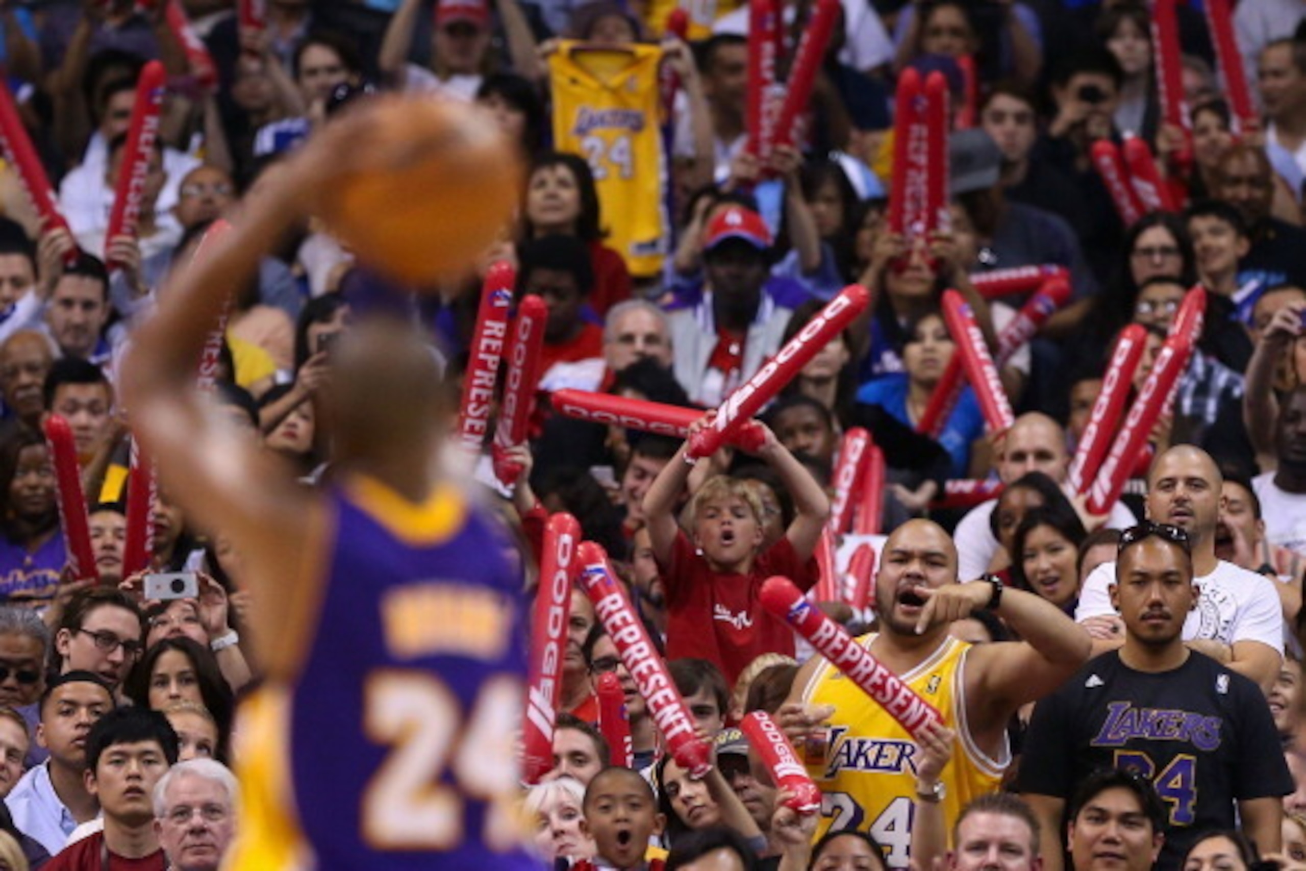 LOS ANGELES, CA - APRIL 07:  Fans of the Los Angeles Lakers and Los Angeles Clippers cheer as Kobe Bryant #24 takes a free throw shot during the NBA game at Staples Center on April 7, 2013 in Los Angeles, California.  The Clippers defeated the Lakers 109-