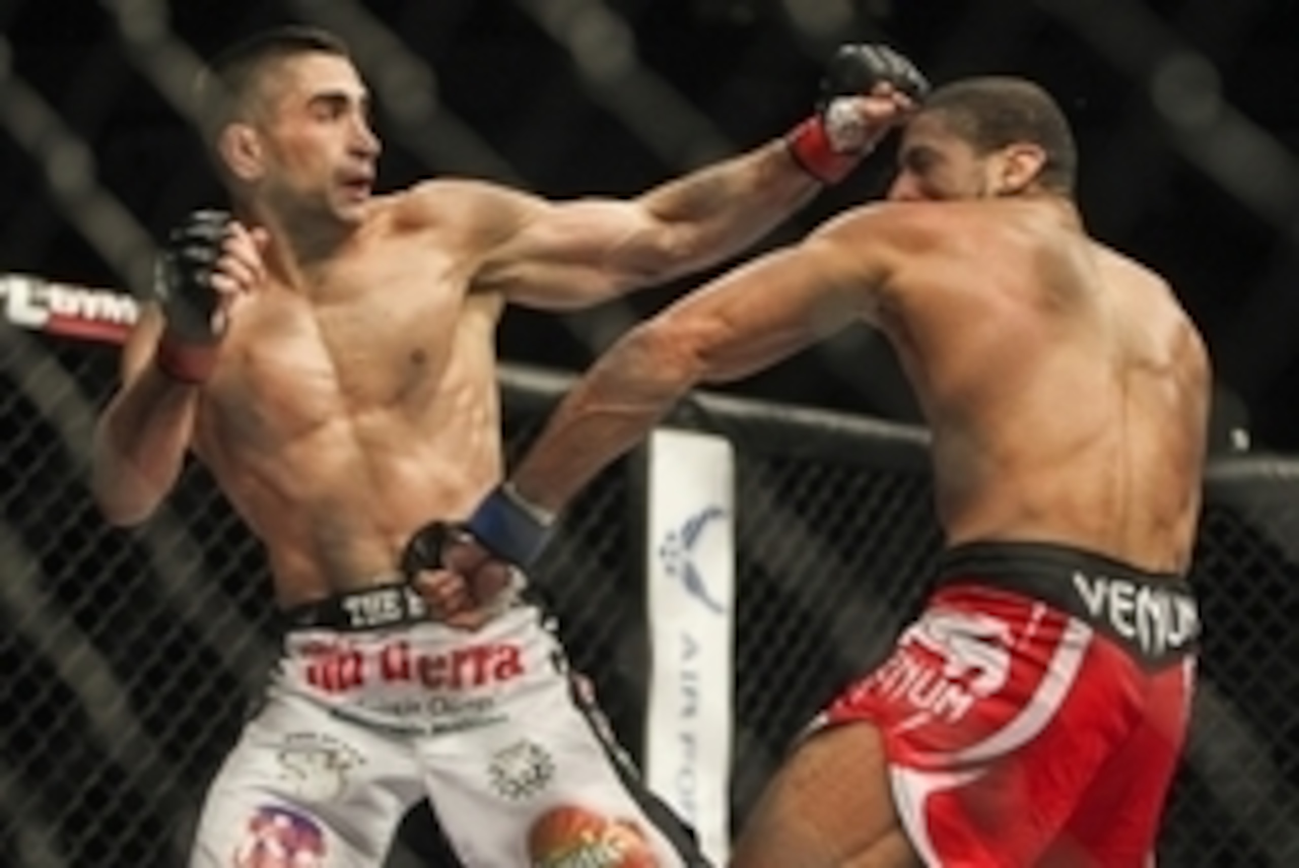 Jun 28, 2014; San Antonio, TX, USA; Ricardo Lamas (red gloves) fights Hacran Dias (blue gloves) in a Featherweight bout at UFC Fight Night 43 at AT&T Center. Mandatory Credit: Troy Taormina-USA TODAY Sports