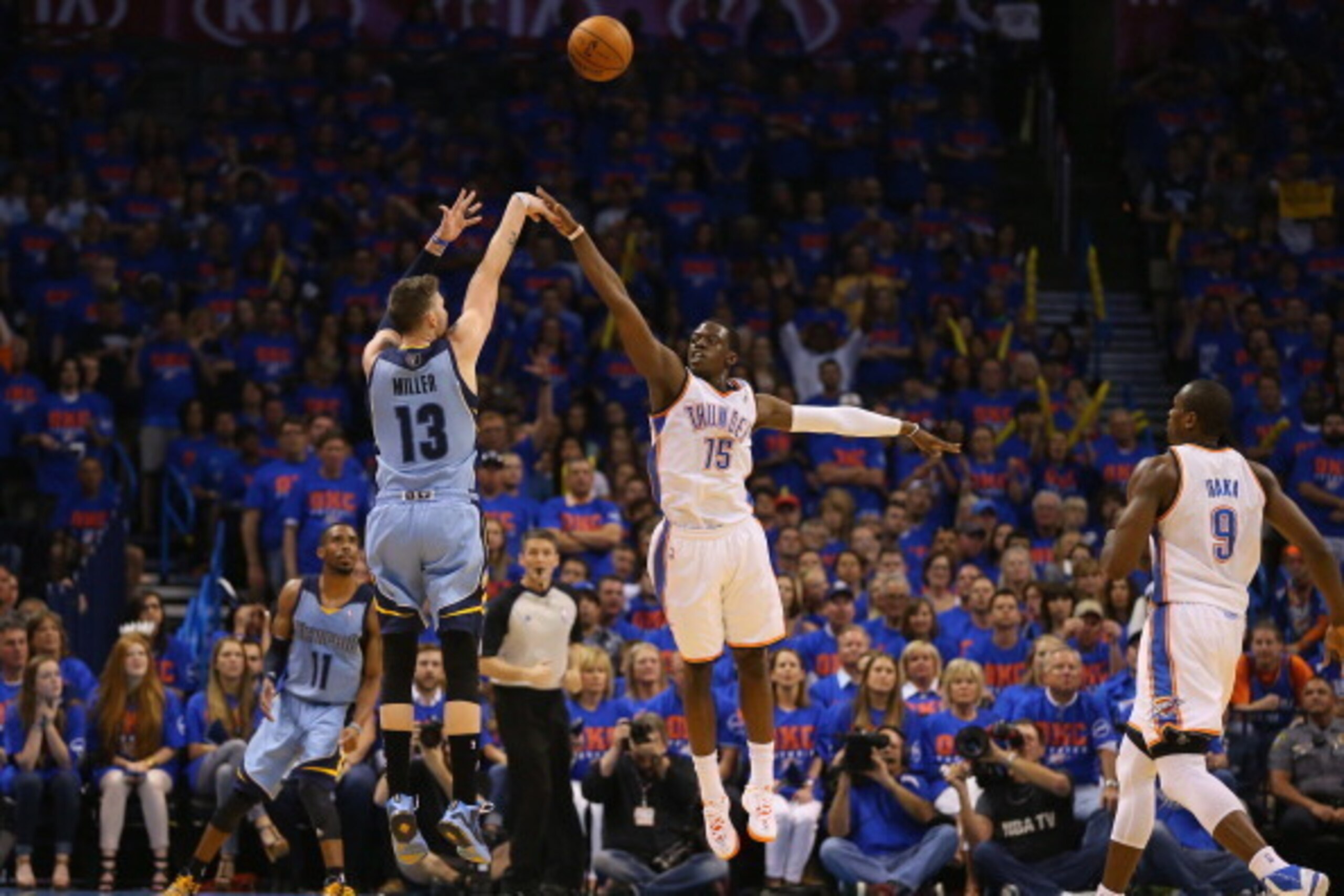 OKLAHOMA CITY, OK - MAY 03:  Mike Miller #13 of the Memphis Grizzlies takes a shot against Reggie Jackson #15 of the Oklahoma City Thunder in Game Seven of the Western Conference Quarterfinals during the 2014 NBA Playoffs at Chesapeake Energy Arena on May