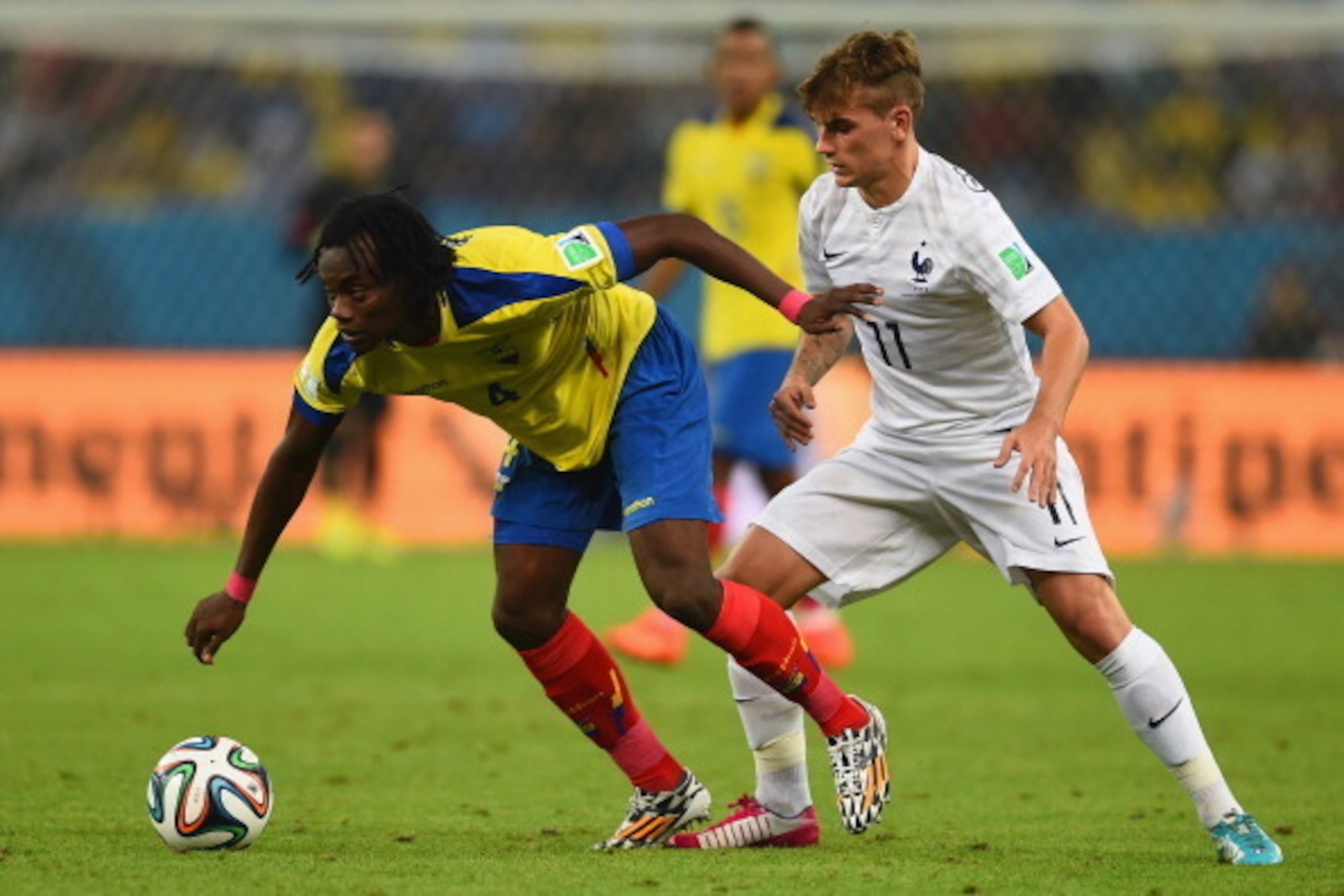 RIO DE JANEIRO, BRAZIL - JUNE 25: Juan Carlos Paredes of Ecuador controls the ball against Antoine Griezmann of France during the 2014 FIFA World Cup Brazil Group E match between Ecuador and France at Maracana on June 25, 2014 in Rio de Janeiro, Brazil.  