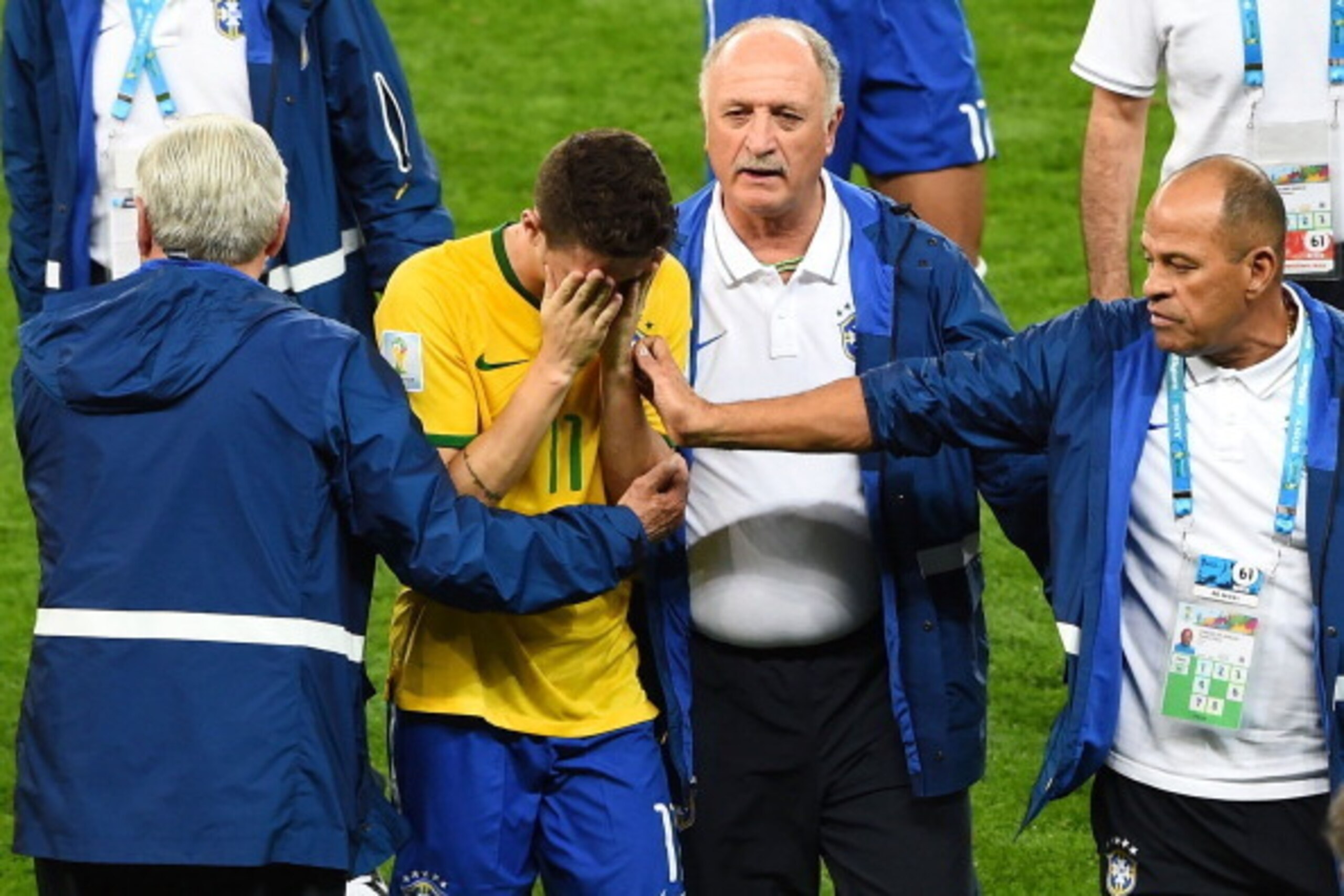 BELO HORIZONTE, BRAZIL - JULY 08:  Head coach Luiz Felipe Scolari of Brazil and staff console Oscar after a 7-1 defeat to Germany during the 2014 FIFA World Cup Brazil Semi Final match between Brazil and Germany at Estadio Mineirao on July 8, 2014 in Belo