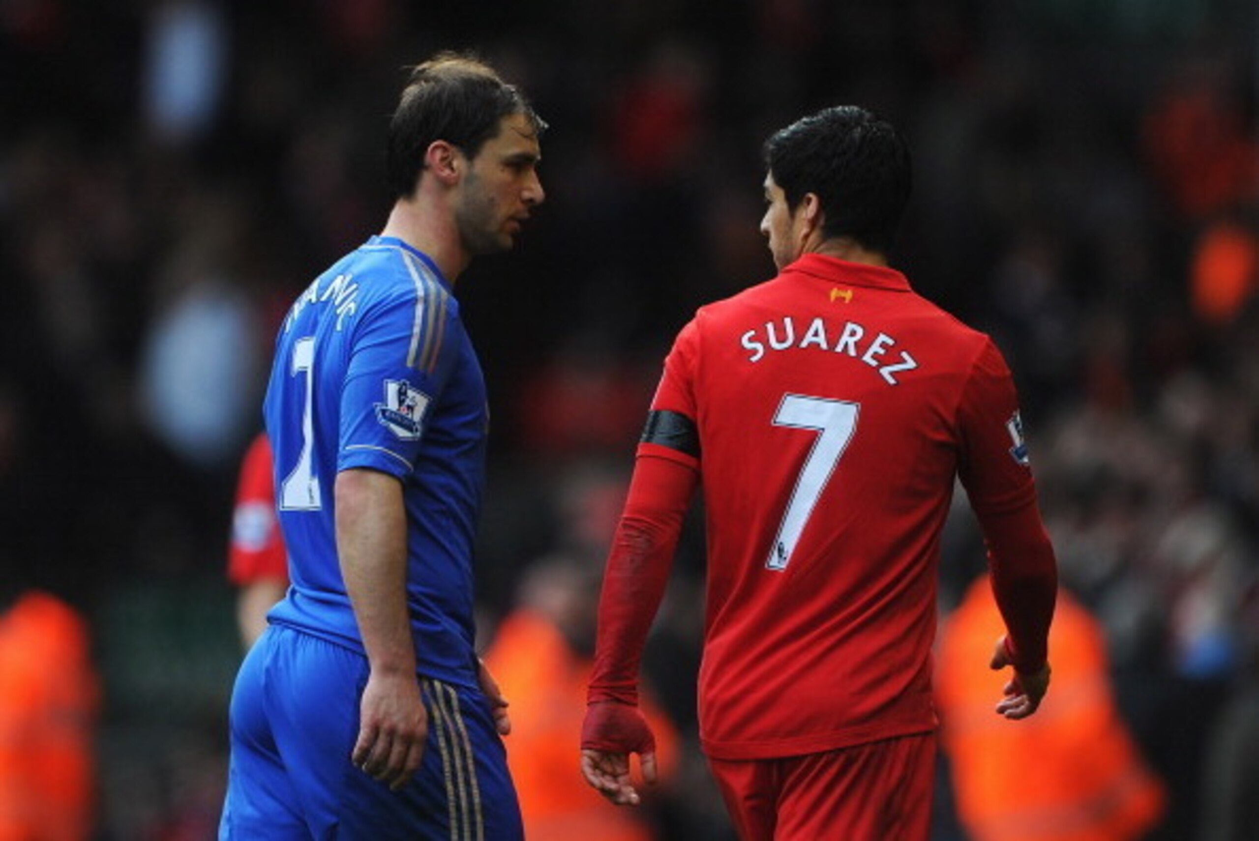 LIVERPOOL, ENGLAND - APRIL 21:  Branislav Ivanovic of Chelsea talks with Luis Suarez of Liverpool as they walk in for half time during the Barclays Premier League match between Liverpool and Chelsea at Anfield on April 21, 2013 in Liverpool, England.  (Ph