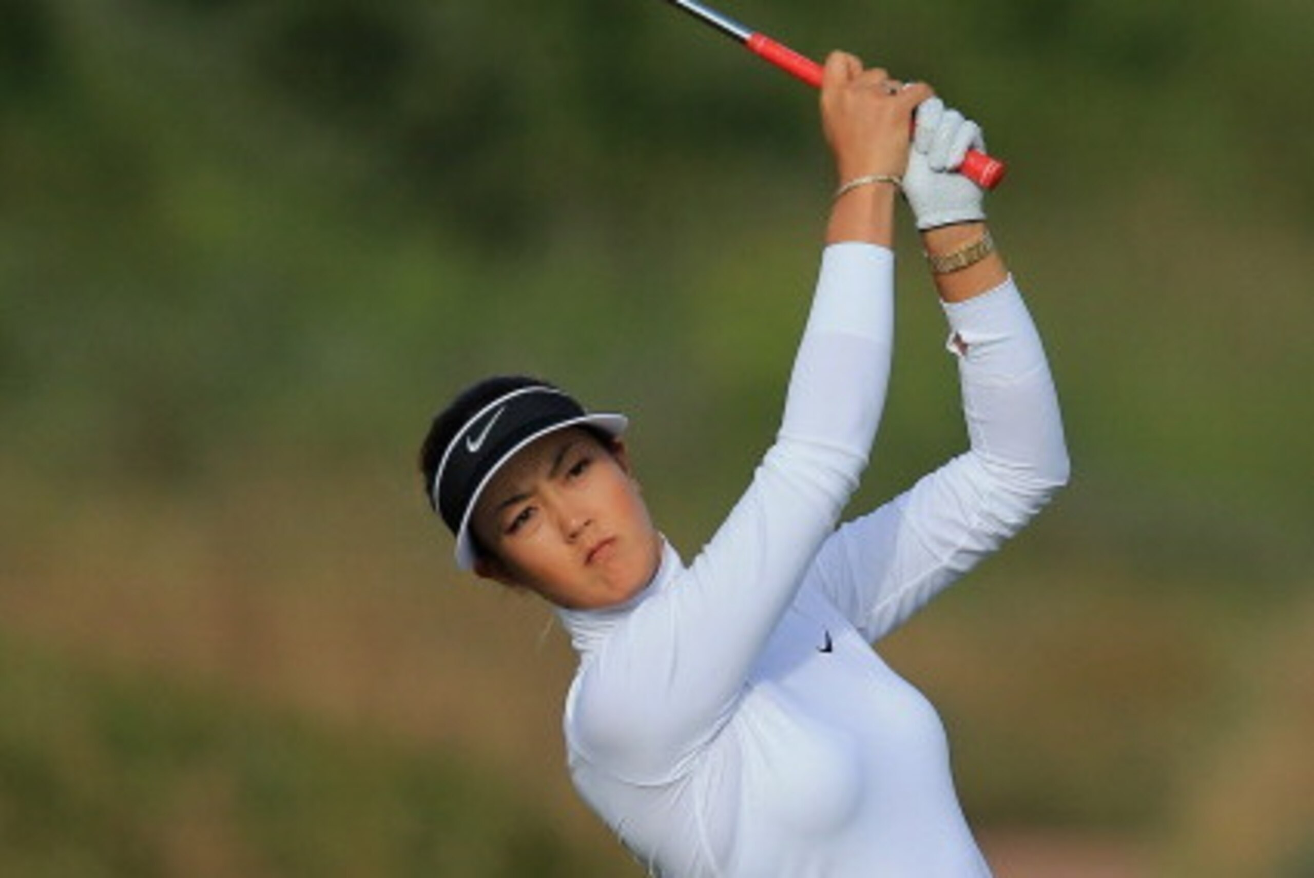 SOUTHPORT, ENGLAND - JULY 10:  Michelle Wie of the United States hits her 2nd shot on the 3rd hole during the first round of the Ricoh Women's British Open at Royal Birkdale on July 10, 2014 in Southport, England.  (Photo by David Cannon/Getty Images)