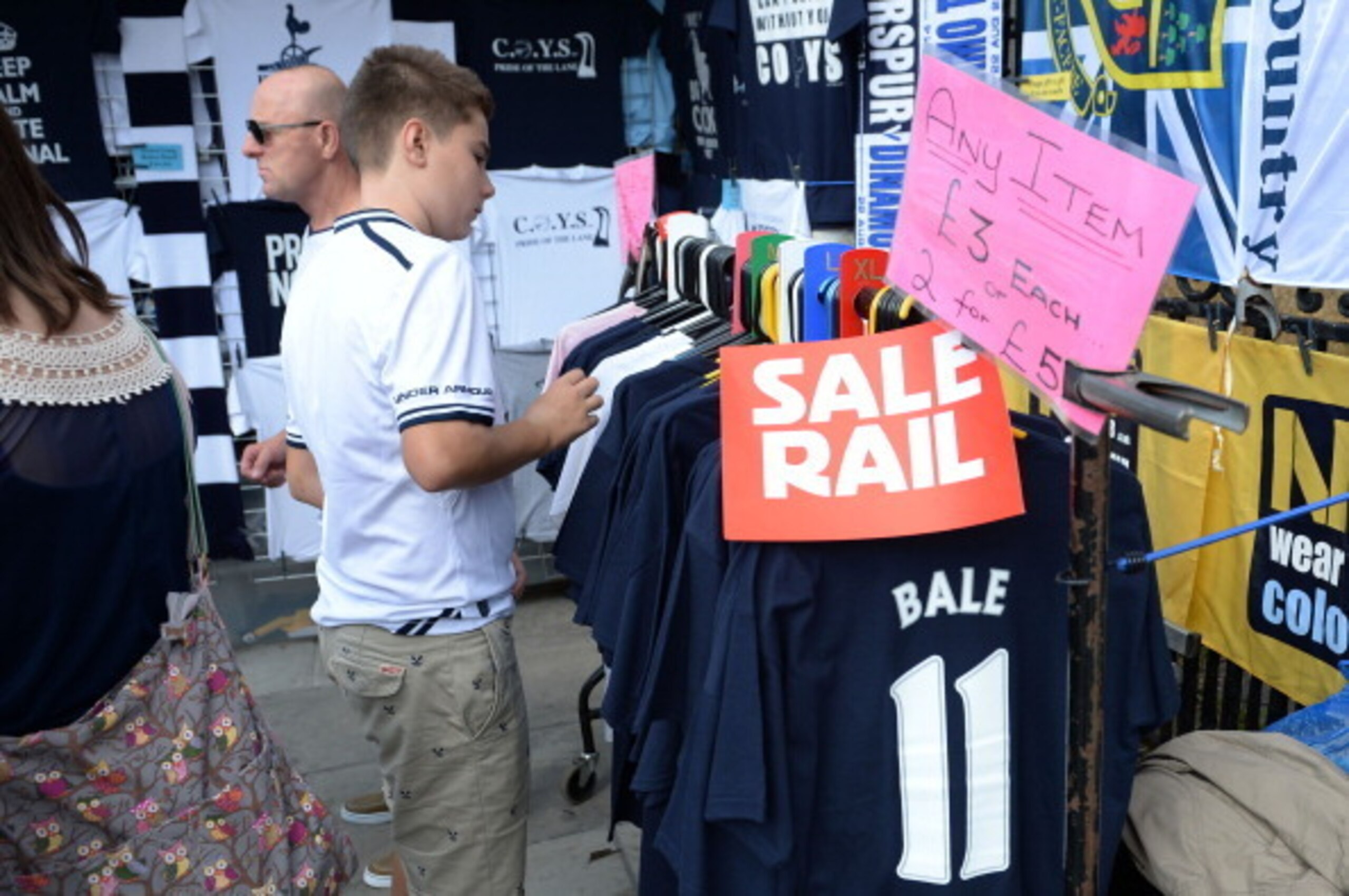 LONDON, ENGLAND - AUGUST 25:  Cut price Gareth Bale merchandise is offered by vendors prior to kick off during the Barclays Premier League match between Tottenham Hotspur and Swansea City at White Hart Lane on August 25, 2013 in London, England.  (Photo b