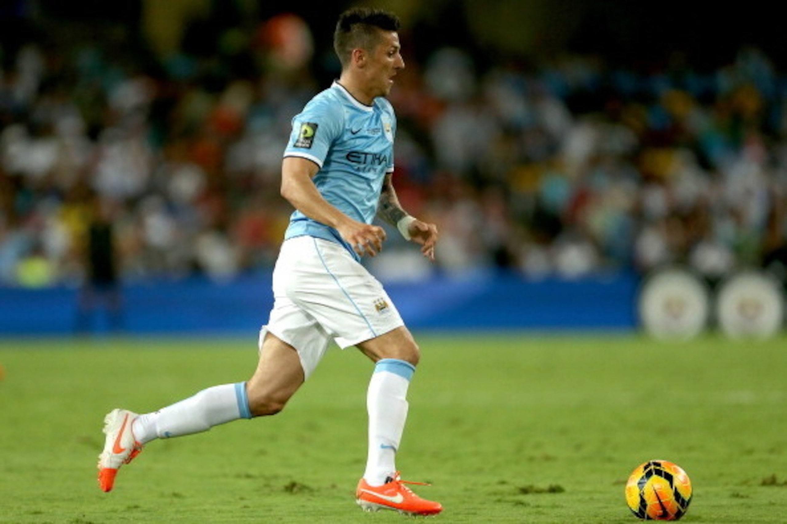 AL AIN, UNITED ARAB EMIRATES - MAY 15:  Stevan Jovetic of Manchester City in action during the friendly match between Al Ain and Manchester City at Hazza bin Zayed Stadium on May 15, 2014 in Al Ain, United Arab Emirates.  (Photo by Warren Little/Getty Ima