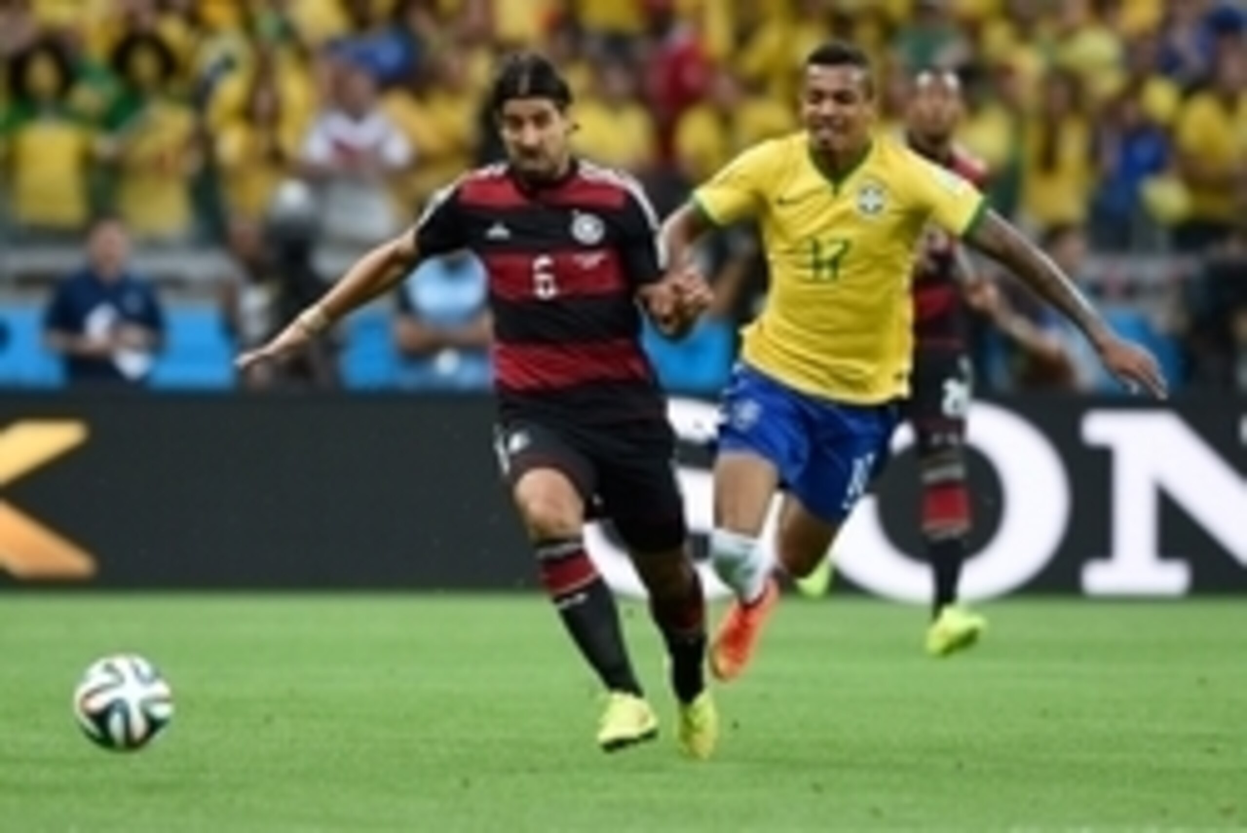 July 8, 2014; Belo Horizonte, BRAZIL; Germany player Sami Khedira (left) battles for the ball with Brazil player Luiz Gustavo during the semifinal match in the 2014 World Cup at Mineirao Stadium.  Mandatory Credit: Tim Groothuis/Witters Sport via USA TODA