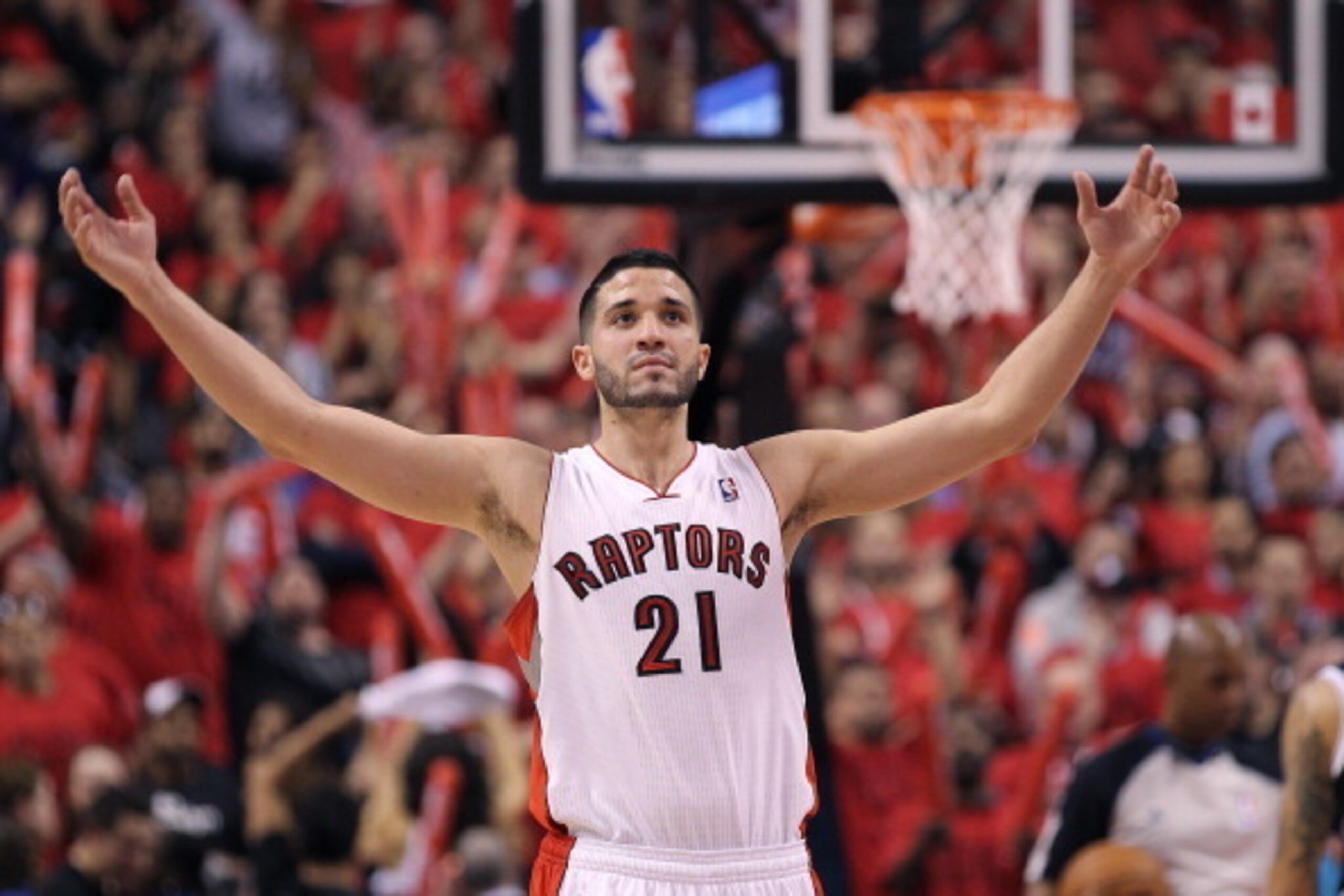 TORONTO, ON - MAY 4:  Greivis Vasquez #21 of the Toronto Raptors gets the crowd going against the Brooklyn Nets in Game Seven of the NBA Eastern Conference Quarterfinals at the Air Canada Centre on May 4, 2014 in Toronto, Ontario, Canada. The Nets defeate