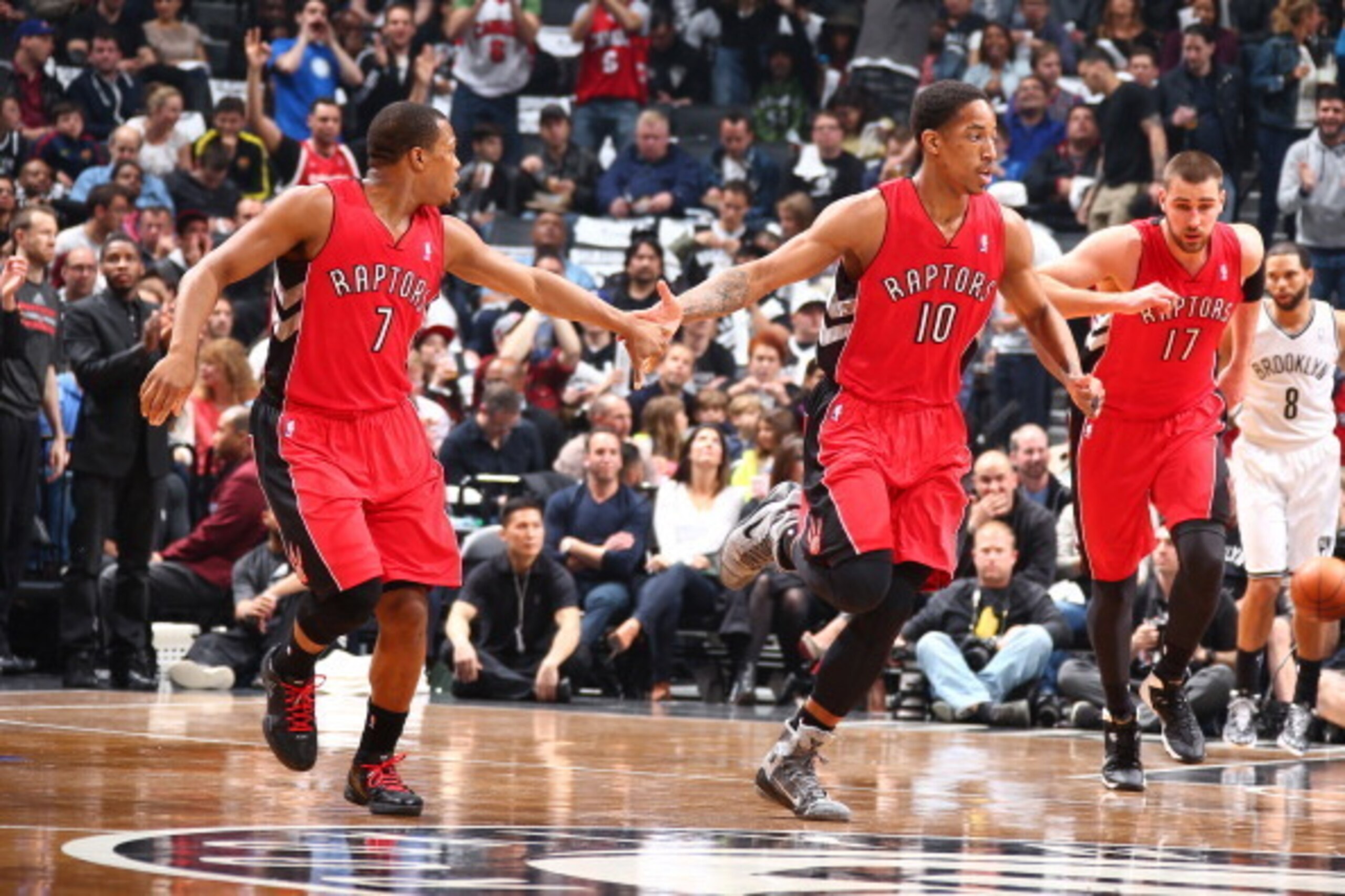 BROOKLYN, NY - APRIL 27:  Kyle Lowry #7 and DeMar DeRozan #10 of the Toronto Raptors shake hands against the Brooklyn Nets during Game Four of the Eastern Conference Quarterfinals  at Barclays Center in Brooklyn. NOTE TO USER: User expressly acknowledges 