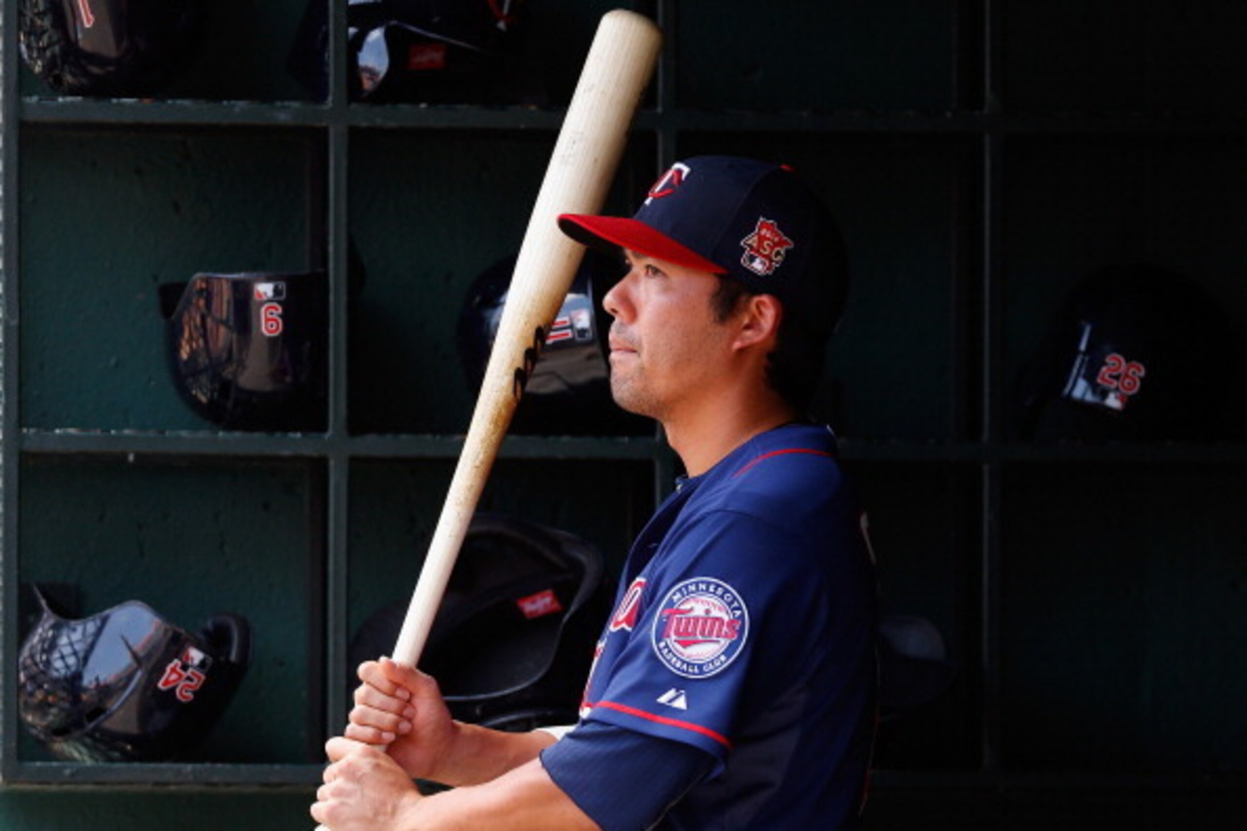 ARLINGTON, TX - JUNE 29:  Kurt Suzuki #8 of the Minnesota Twins looks on from the dugout ad the Twins take on the Texas Rangers at Globe Life Park in Arlington on June 29, 2014 in Arlington, Texas.  (Photo by Tom Pennington/Getty Images)