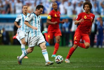 BRASILIA, BRAZIL - JULY 05:  Lionel Messi of Argentina attempts to chip the keeper during the 2014 FIFA World Cup Brazil Quarter Final match between Argentina and Belgium at Estadio Nacional on July 5, 2014 in Brasilia, Brazil.  (Photo by Julian Finney/Ge