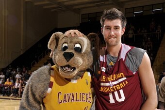 BEREA, OH - OCTOBER 5:  Sergey Karasev #10 of the Cleveland Cavaliers poses with mascot Moondog following the annual Wine & Gold Scrimmage at The Rudolph Ursprung Gymnasium on October 5, 2013 in Berea, Ohio. NOTE TO USER: User expressly acknowledges and a