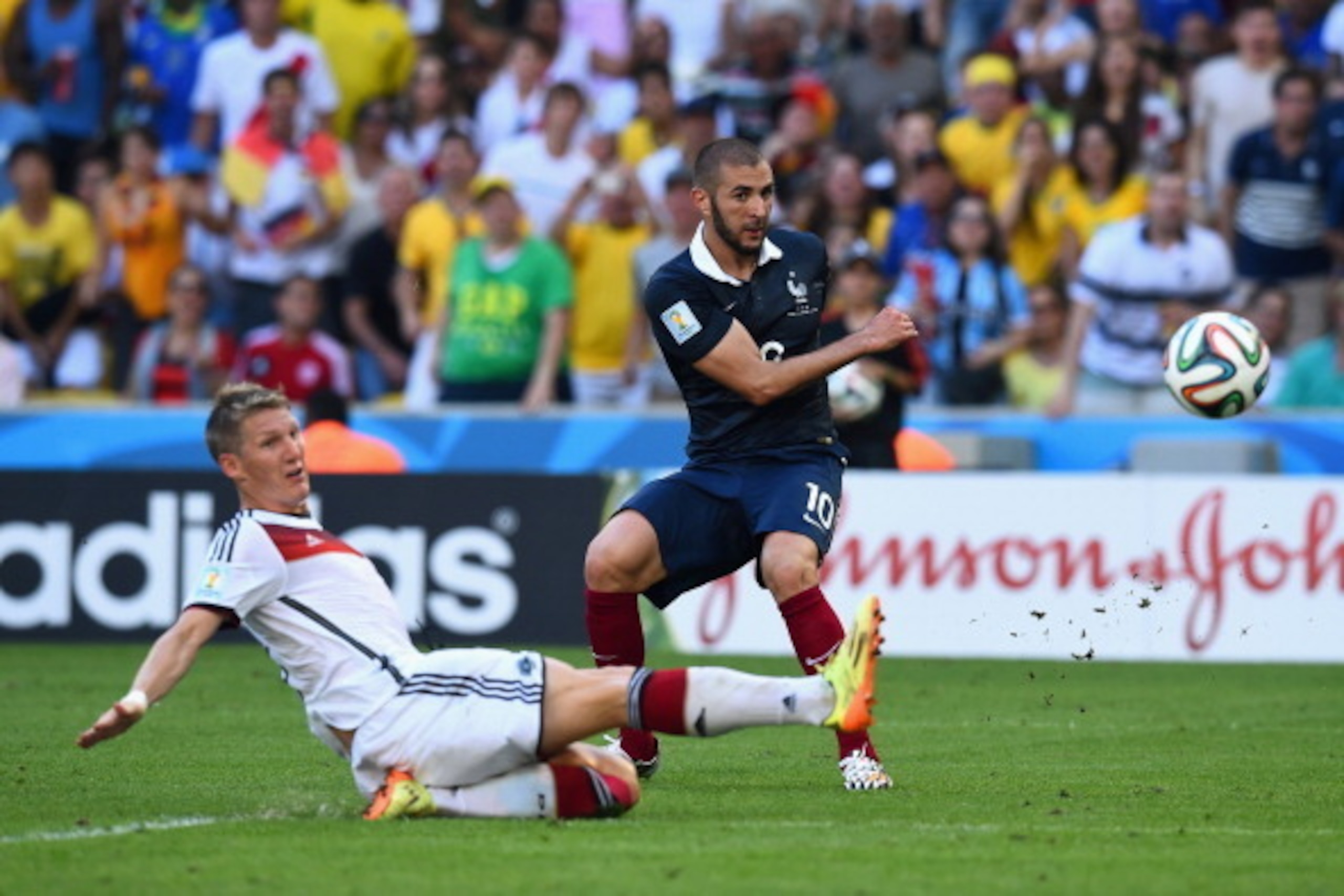 RIO DE JANEIRO, BRAZIL - JULY 04: Bastian Schweinsteiger of Germany tackles Karim Benzema of France during the 2014 FIFA World Cup Brazil Quarter Final match between France and Germany at Maracana on July 4, 2014 in Rio de Janeiro, Brazil. (Photo by Mat RIO DE JANEIRO, BRAZIL - JULY 04: Bastian Schweinsteiger of Germany tackles Karim Benzema of France during the 2014 FIFA World Cup Brazil Quarter Final match between France and Germany at Maracana on July 4, 2014 in Rio de Janeiro, Brazil. (Photo by Mat