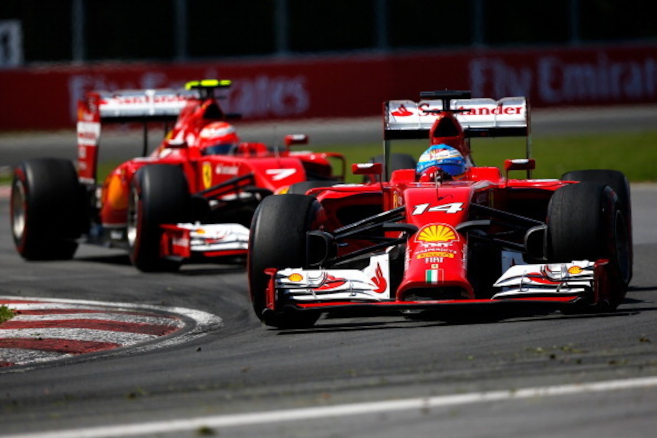 MONTREAL, QC - JUNE 08:  Fernando Alonso of Spain and Ferrari leads teammate Kimi Raikkonen of Finland and Ferrari during the Canadian Formula One Grand Prix at Circuit Gilles Villeneuve on June 8, 2014 in Montreal, Canada.  (Photo by Tom Pennington/Getty