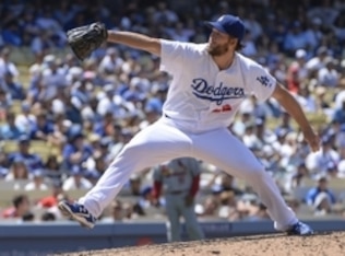Jun 29, 2014; Los Angeles, CA, USA; Los Angeles Dodgers starting pitcher Clayton Kershaw (22) throws in the 5th inning against the St. Louis Cardinals at Dodger Stadium. Mandatory Credit: Robert Hanashiro-USA TODAY Sports