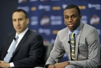 Jun 27, 2014; Independence, OH, USA; Cleveland Cavaliers head coach David Blatt (left) listens as first round pick Andrew Wiggins speaks to the media at Cleveland Clinic Courts. Mandatory Credit: David Richard-USA TODAY Sports