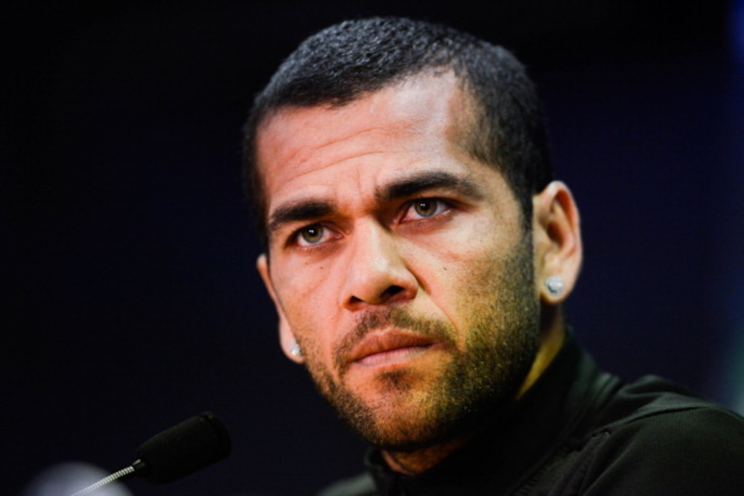 BARCELONA, SPAIN - MARCH 31: Dani Alves of FC Barcelona faces the media during a press conference ahead the UEFA Champions League Quarter Final first leg match against Atletico de Madrid at Sant Joan Despi Sport Complex on March 31, 2014 in Barcelona, Sp BARCELONA, SPAIN - MARCH 31: Dani Alves of FC Barcelona faces the media during a press conference ahead the UEFA Champions League Quarter Final first leg match against Atletico de Madrid at Sant Joan Despi Sport Complex on March 31, 2014 in Barcelona, Sp