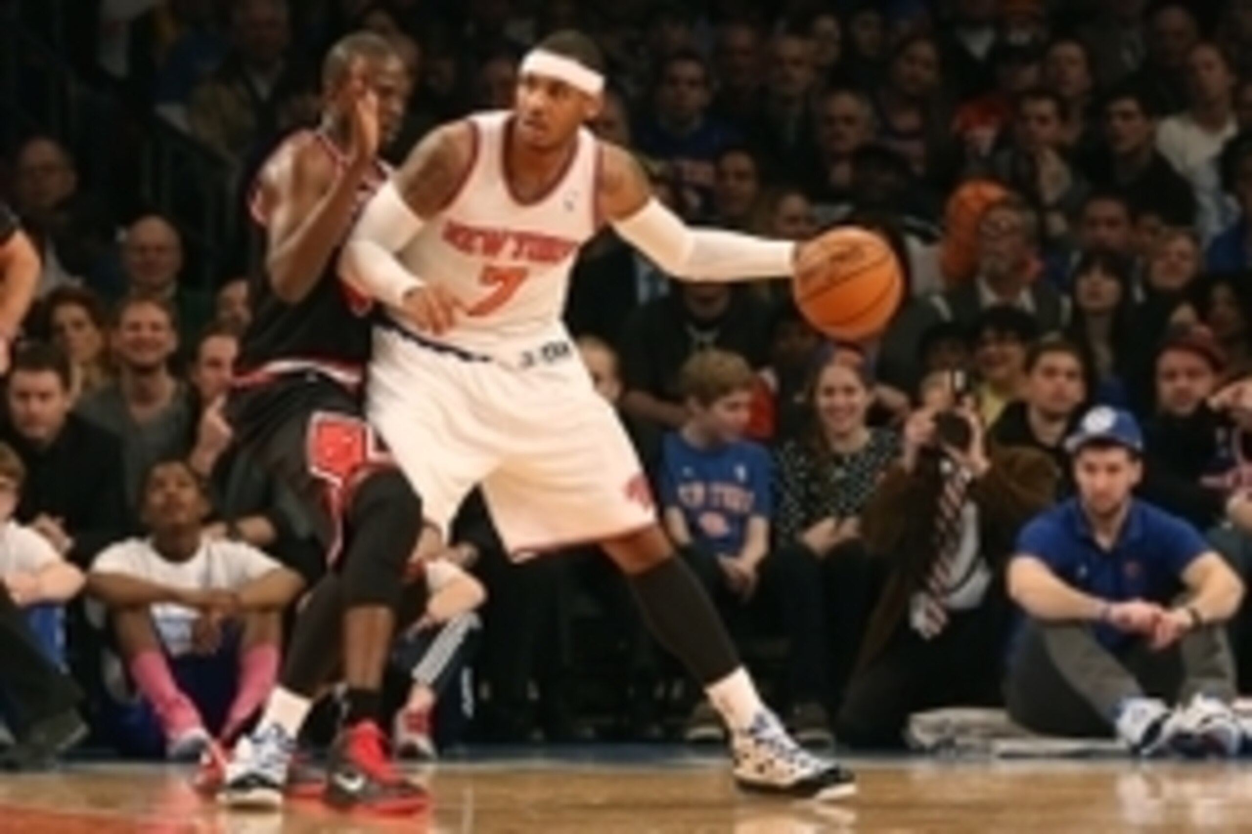 Jan 11, 2013; New York, NY, USA;  New York Knicks small forward Carmelo Anthony (7) holds off Chicago Bulls small forward Luol Deng (9) during the first quarter at Madison Square Garden.  Mandatory Credit: Anthony Gruppuso-USA TODAY Sports