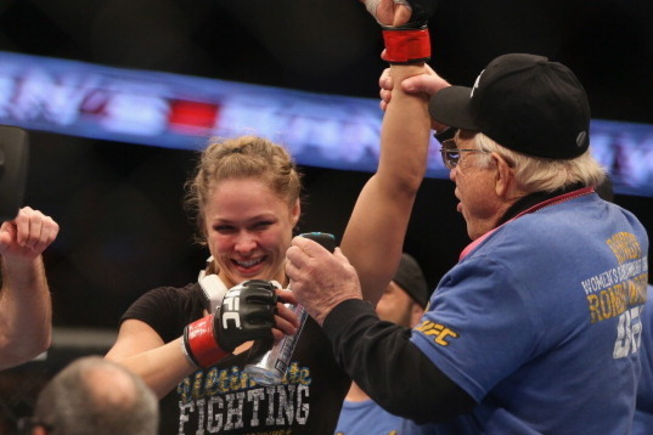 ANAHEIM, CA - FEBRUARY 23:  Ronda Rousey celebrates her UFC Bantamweight Title over Liz Carmouche with a member of her team during UFC 157 at Honda Center on February 23, 2013 in Anaheim, California.  (Photo by Jeff Gross/Getty Images)