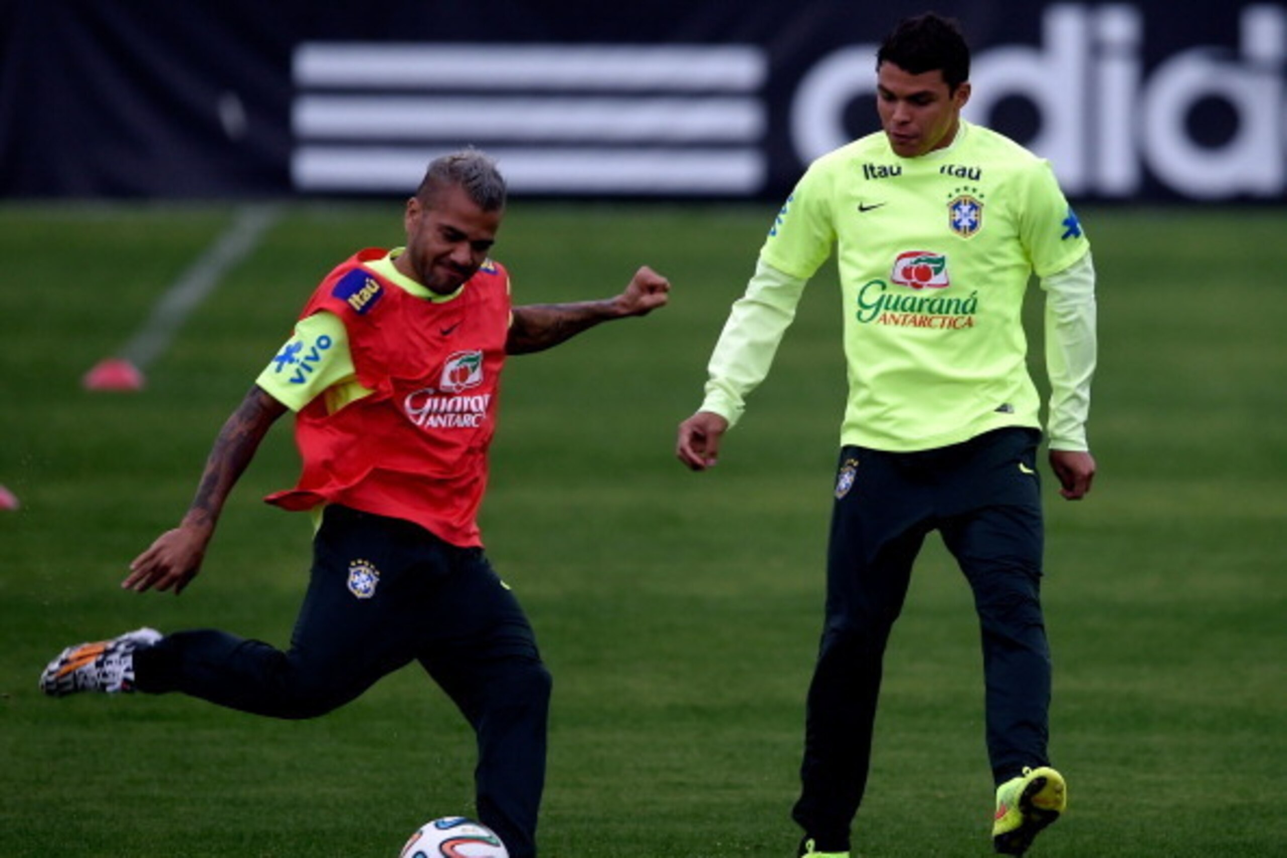 TERESOPOLIS, BRAZIL - JULY 10:  Daniel Alves and Thiago Silva (R) take part during a training session of the Brazilian national football team at the squad's Granja Comary training complex, on July 10, 2014 in Teresopolis, 90 km from downtown Rio de Janeir