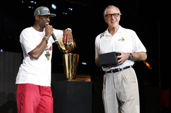 MIAMI, FL - JUNE 25:  Dwyane Wade #3 of the Miami Heat speaks on stage as the Miami Heat President Pat Riley looks on during a rally for the 2012 NBA Champions Miami Heat at American Airlines Arena on June 25, 2012 in Miami, Florida.  NOTE TO USER: User e