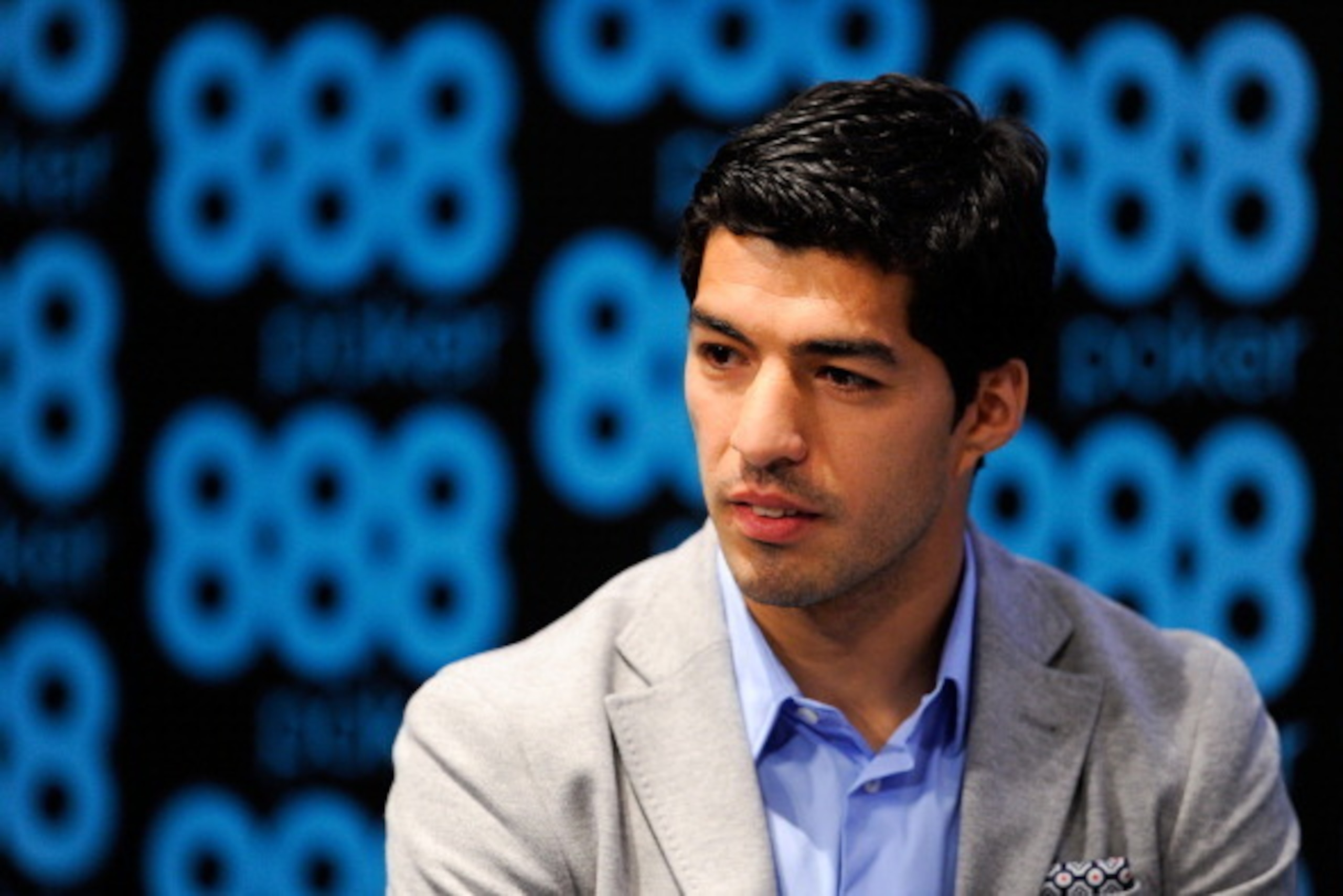 BARCELONA, SPAIN - MAY 14:  Luis Suarez of Liverpool faces the media during the presentation as new Ambassador for 888poker on May 14, 2014 in Barcelona, Spain.  (Photo by David Ramos/Getty Images)