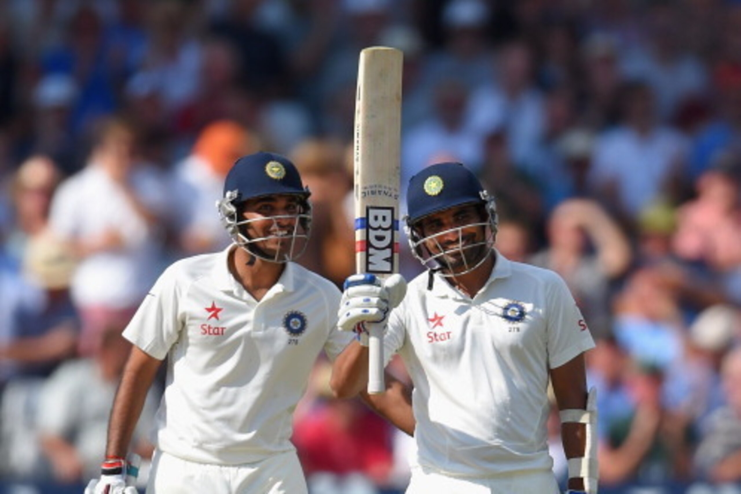 NOTTINGHAM, ENGLAND - JULY 10:  India batsman Mohammed Shami (r) and partner Bhuvneshwar Kumar celebrate their 100 partnership for the last wicket and Shami's 50 which he had reached with a straight six during day two of the 1st  Investec Test Match betwe