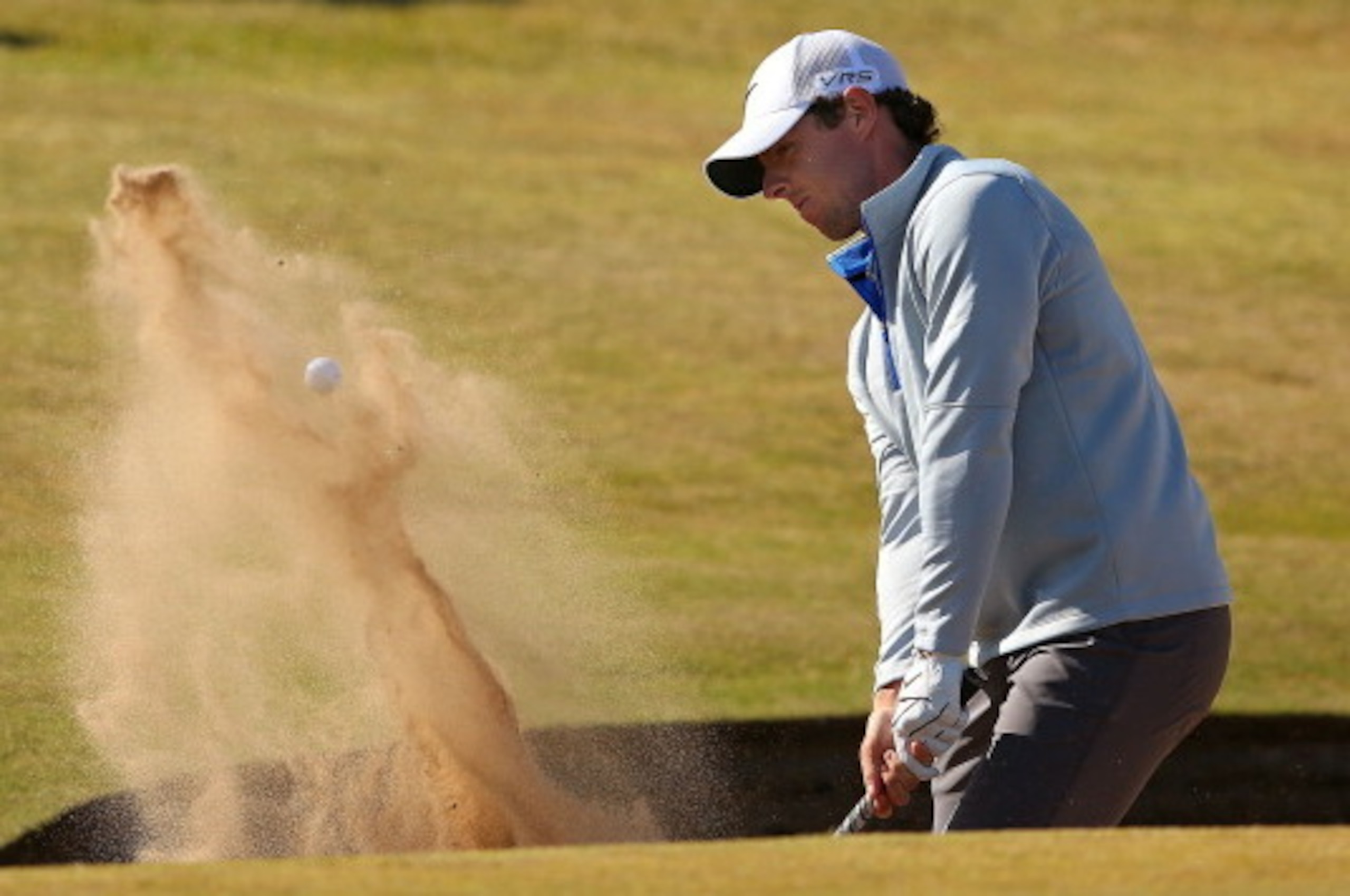 ABERDEEN, SCOTLAND - JULY 11: Rory Mcilroy of Northern Ireland plays a bunker shot on the 13th hole during the second round of the 2014 Aberdeen Asset Management Scottish Open at Royal Aberdeen Golf Club on July 11, 2014 in Aberdeen, Scotland. (Photo by ABERDEEN, SCOTLAND - JULY 11: Rory Mcilroy of Northern Ireland plays a bunker shot on the 13th hole during the second round of the 2014 Aberdeen Asset Management Scottish Open at Royal Aberdeen Golf Club on July 11, 2014 in Aberdeen, Scotland. (Photo by