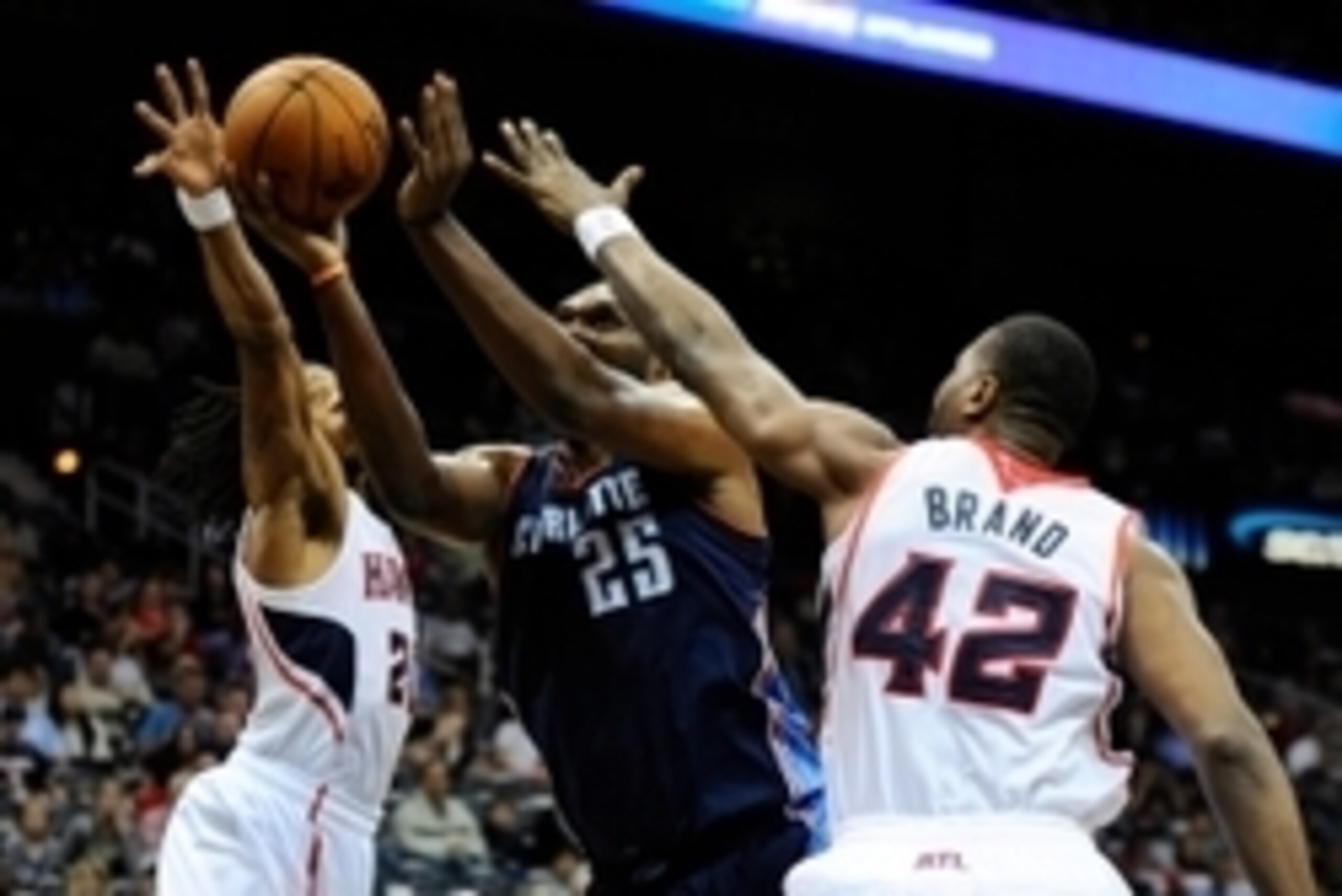 Apr 14, 2014; Atlanta, GA, USA; Charlotte Bobcats center Al Jefferson (25) controls the ball between Atlanta Hawks forward Cartier Martin (20) and forward Elton Brand (42) during the first half at Philips Arena. Mandatory Credit: Dale Zanine-USA TODAY Sp Apr 14, 2014; Atlanta, GA, USA; Charlotte Bobcats center Al Jefferson (25) controls the ball between Atlanta Hawks forward Cartier Martin (20) and forward Elton Brand (42) during the first half at Philips Arena. Mandatory Credit: Dale Zanine-USA TODAY Sp