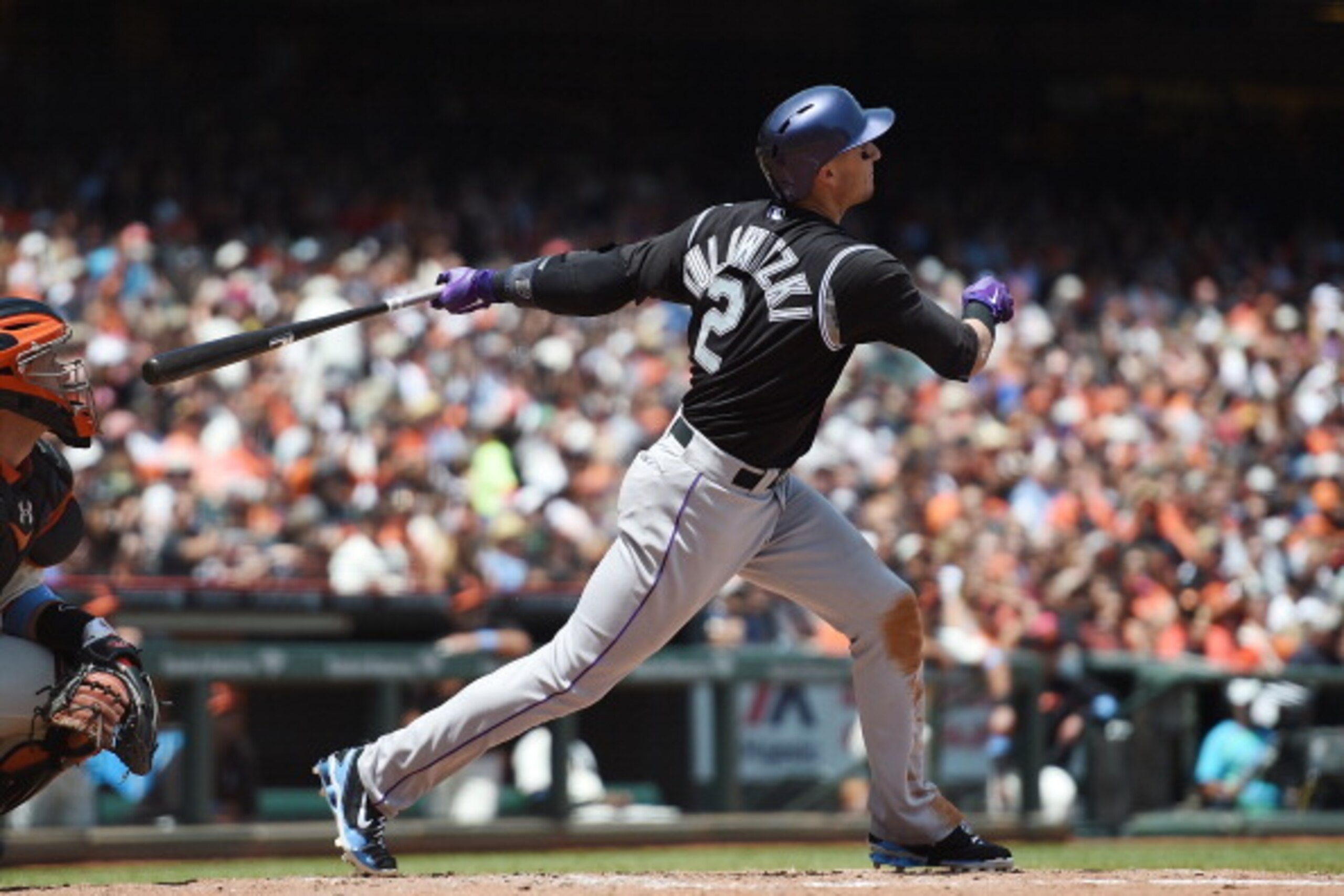 SAN FRANCISCO, CA - JUNE 15:  Troy Tulowitzki #2 of the Colorado Rockies hits a two-run homer in the top of the third inning against the San Francisco Giants at AT&T Park on June 15, 2014 in San Francisco, California.  (Photo by Thearon W. Henderson/Getty