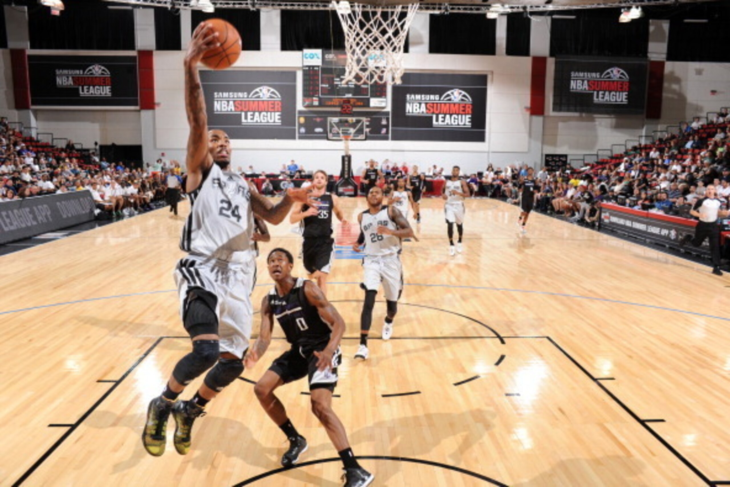 LAS VEGAS, NV - JULY 11: Marcus Denmon #24 of the San Antonio Spurs shoots against the Sacramento Kings on July 11, 2014 at Cox Pavilion in Las Vegas, Nevada. NOTE TO USER: User expressly acknowledges and agrees that, by downloading and or using this phot