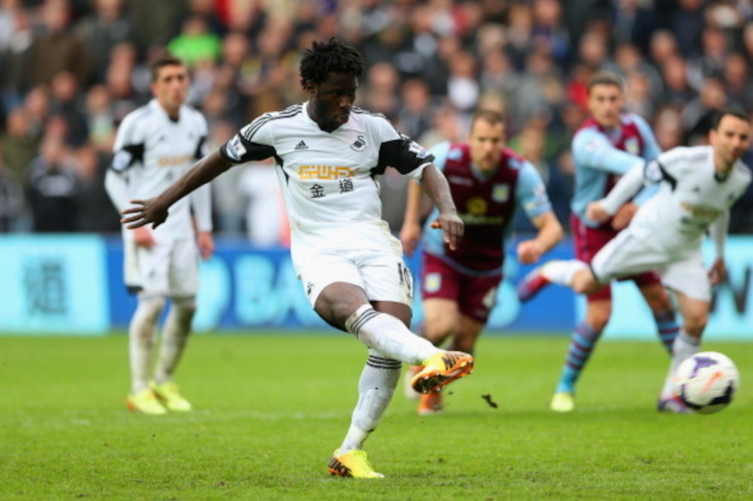SWANSEA, WALES - APRIL 26:  Wilfried Bony of Swansea City scores their fourth goal from the penalty spot during the Barclays Premier League match between Swansea City and Aston Villa at Liberty Stadium on April 26, 2014 in Swansea, Wales.  (Photo by Scott