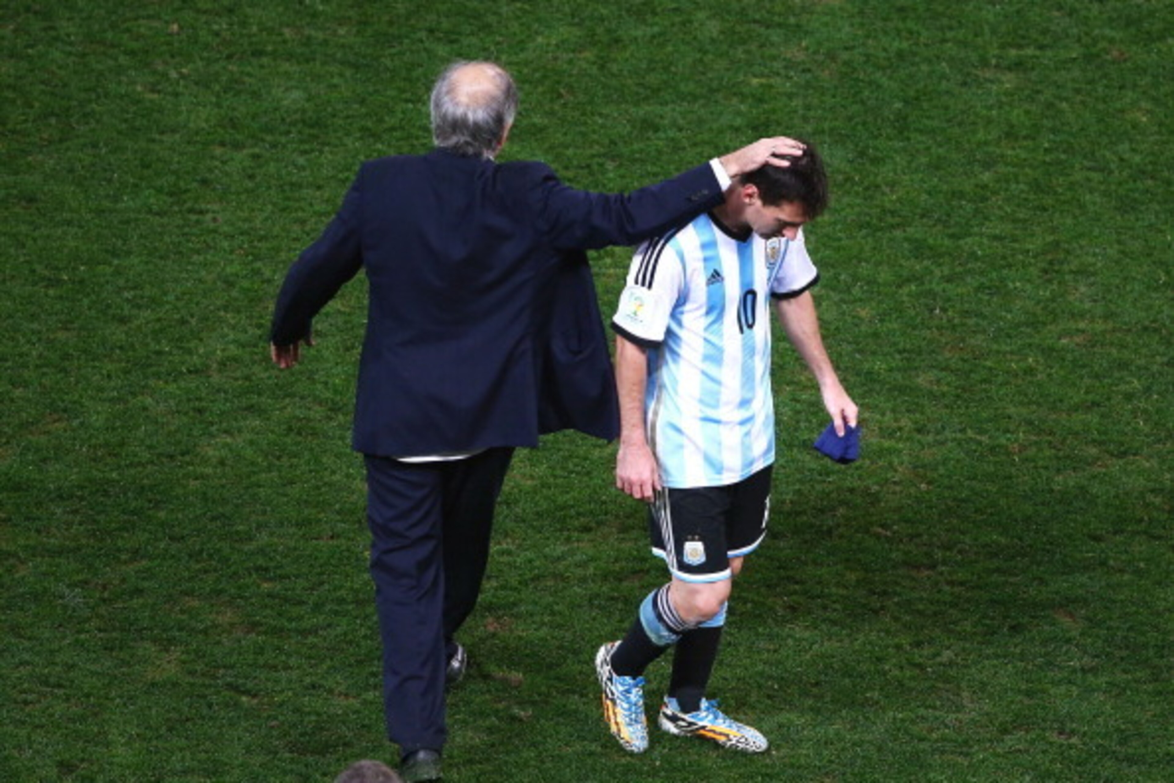 SAO PAULO, BRAZIL - JULY 09: Head coach Alejandro Sabella of Argentina reacts with Lionel Messi at the end of extra time during the 2014 FIFA World Cup Brazil Semi Final match between the Netherlands and Argentina at Arena de Sao Paulo on July 9, 2014 in 