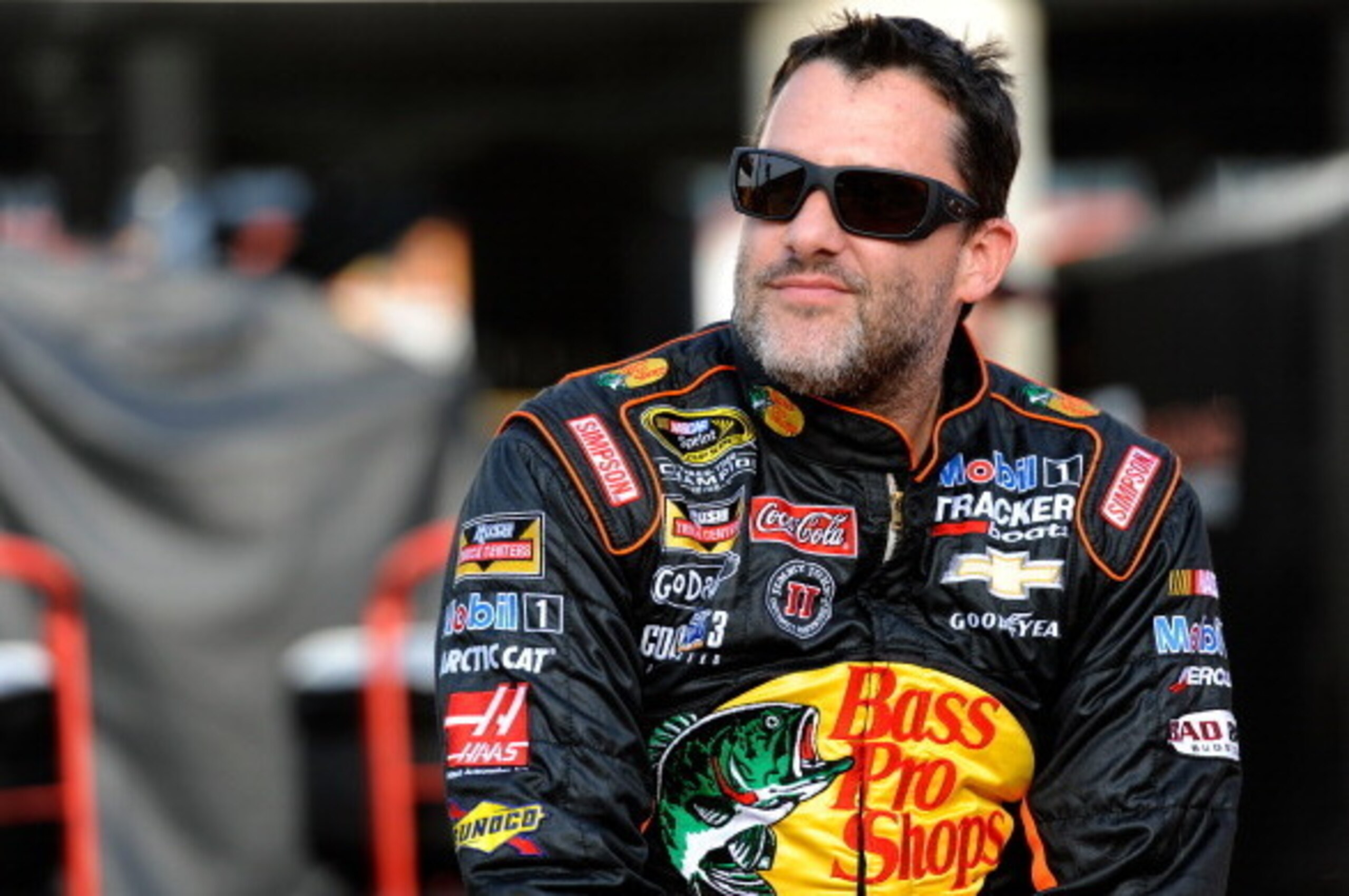 CHARLOTTE, NC - MAY 22:  Tony Stewart, driver of the #14 Bass Pro Shops/Mobil 1 Chevrolet, sits on the pit wall during qualifying for the NASCAR Sprint Cup Series Coca-Cola 600 at Charlotte Motor Speedway on May 22, 2014 in Charlotte, North Carolina.  (Ph