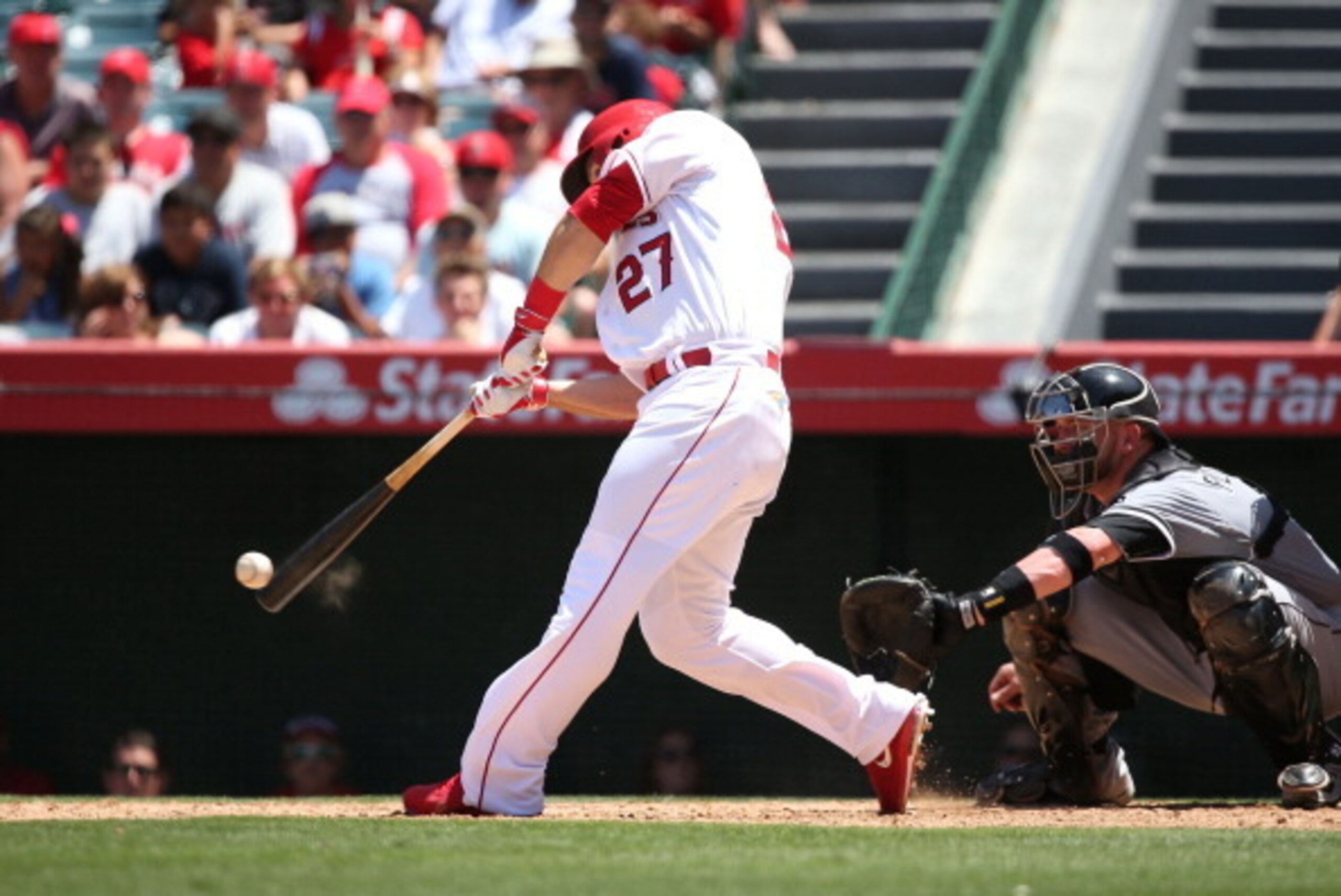 ANAHEIM, CA - JUNE 08:  Mike Trout #27 of the Los Angeles Angels of Anaheim hits a single to left field in the fifth inning during the MLB game against the Chicago White Sox at Angel Stadium of Anaheim on June 8, 2014 in Anaheim, California.  (Photo by Vi