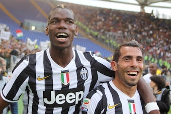 ROME, ITALY - MAY 11: Paul Labile Pogba with Carlos Tevez of Juventus celebrate the victory after the Serie A match between AS Roma and Juventus at Stadio Olimpico on May 11, 2014 in Rome, Italy. (Photo by Paolo Bruno/Getty Images) ROME, ITALY - MAY 11: Paul Labile Pogba with Carlos Tevez of Juventus celebrate the victory after the Serie A match between AS Roma and Juventus at Stadio Olimpico on May 11, 2014 in Rome, Italy. (Photo by Paolo Bruno/Getty Images)